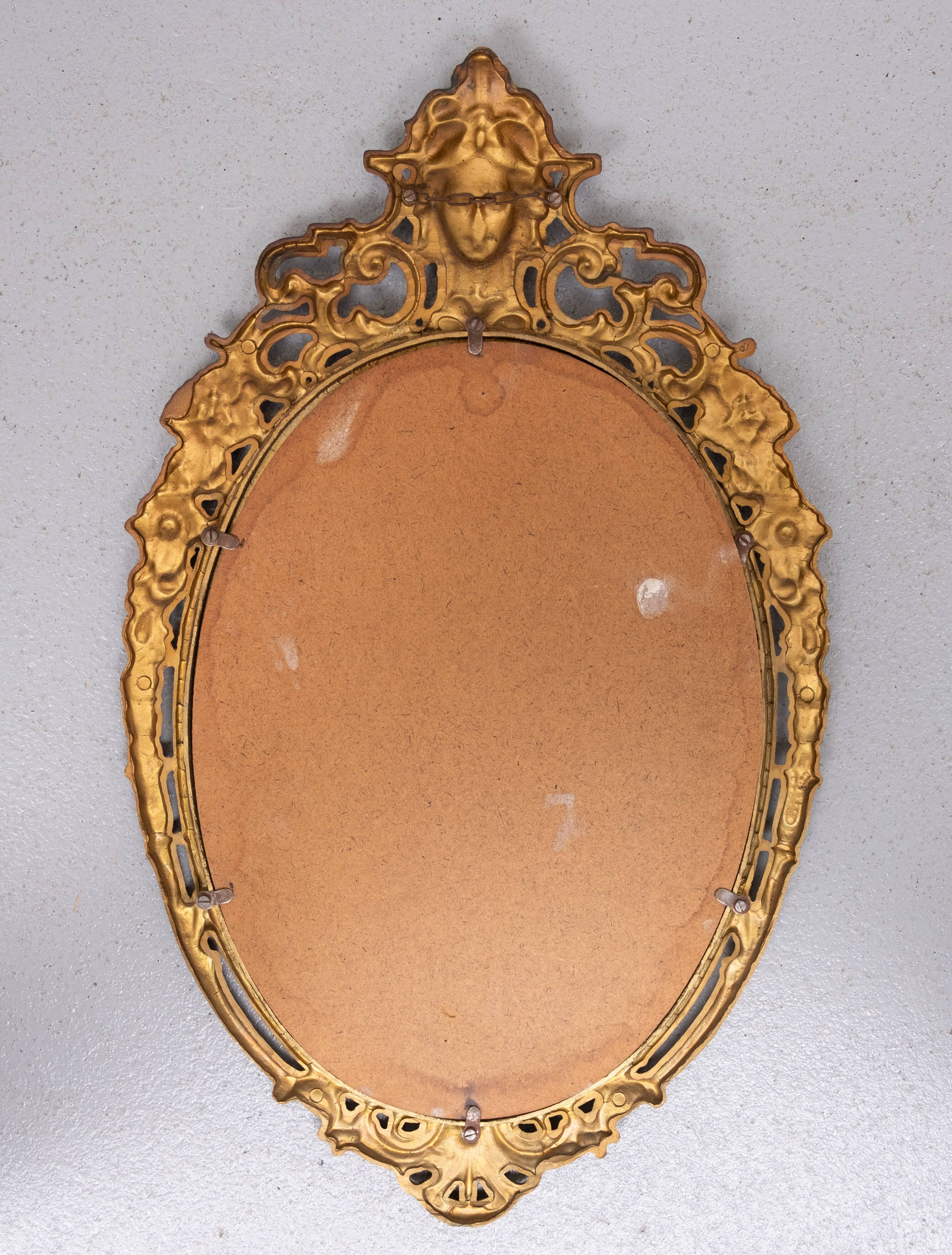 Classic gilded brass console with oval mirror from the 1950s, Italy.