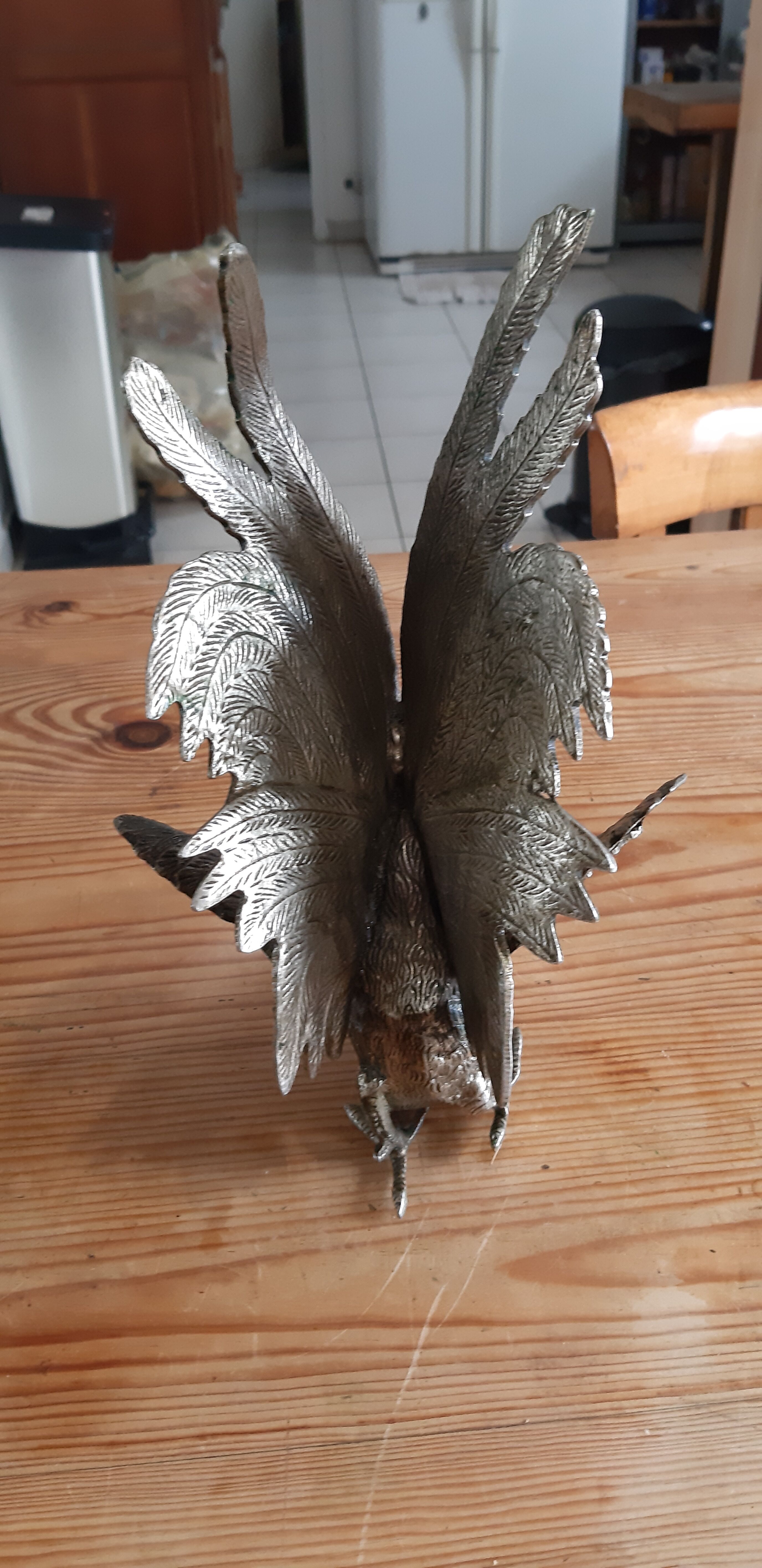 2 silver metal roosters