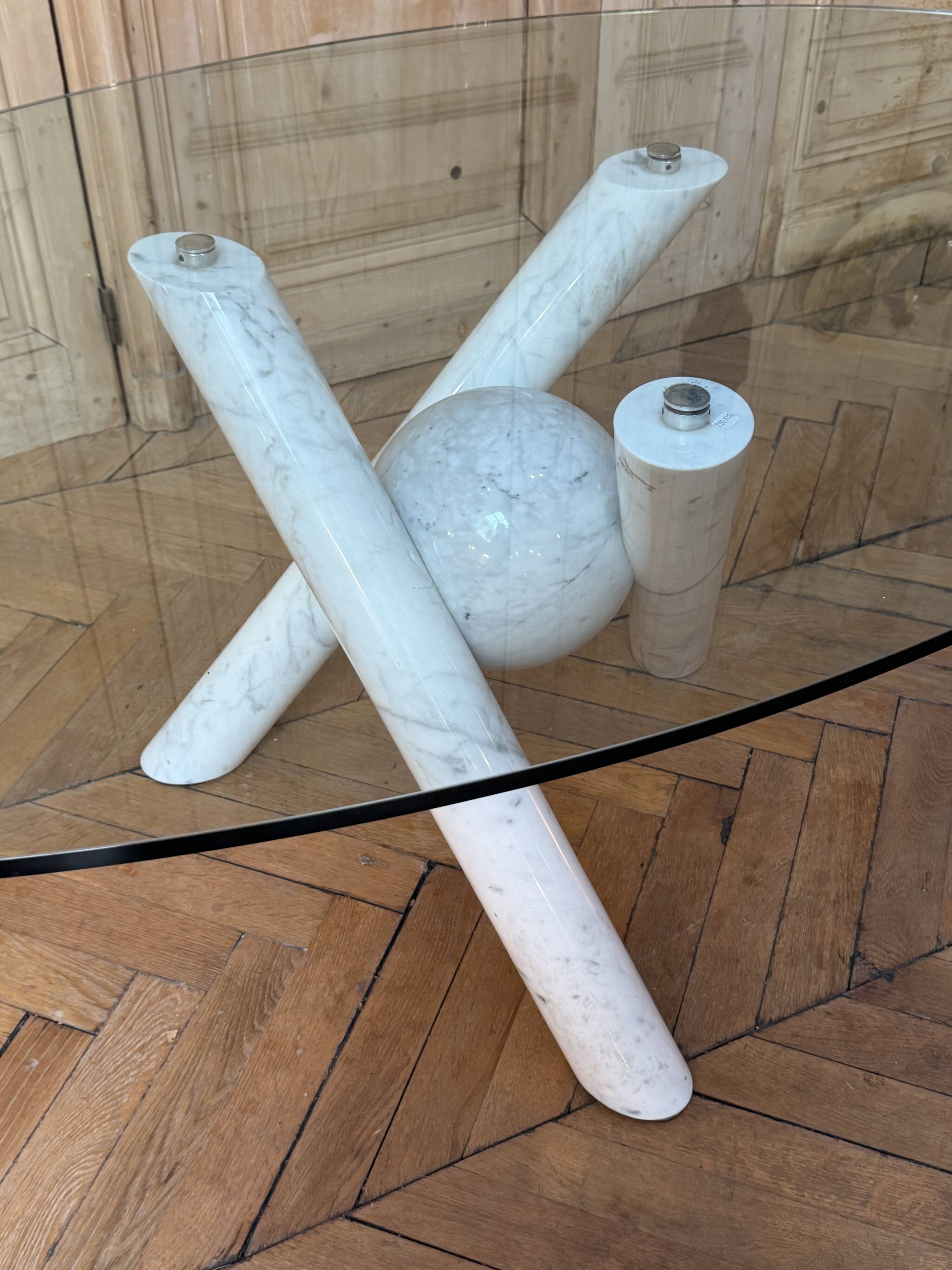 Dining table with glass top and marble base, Ligne Roset.