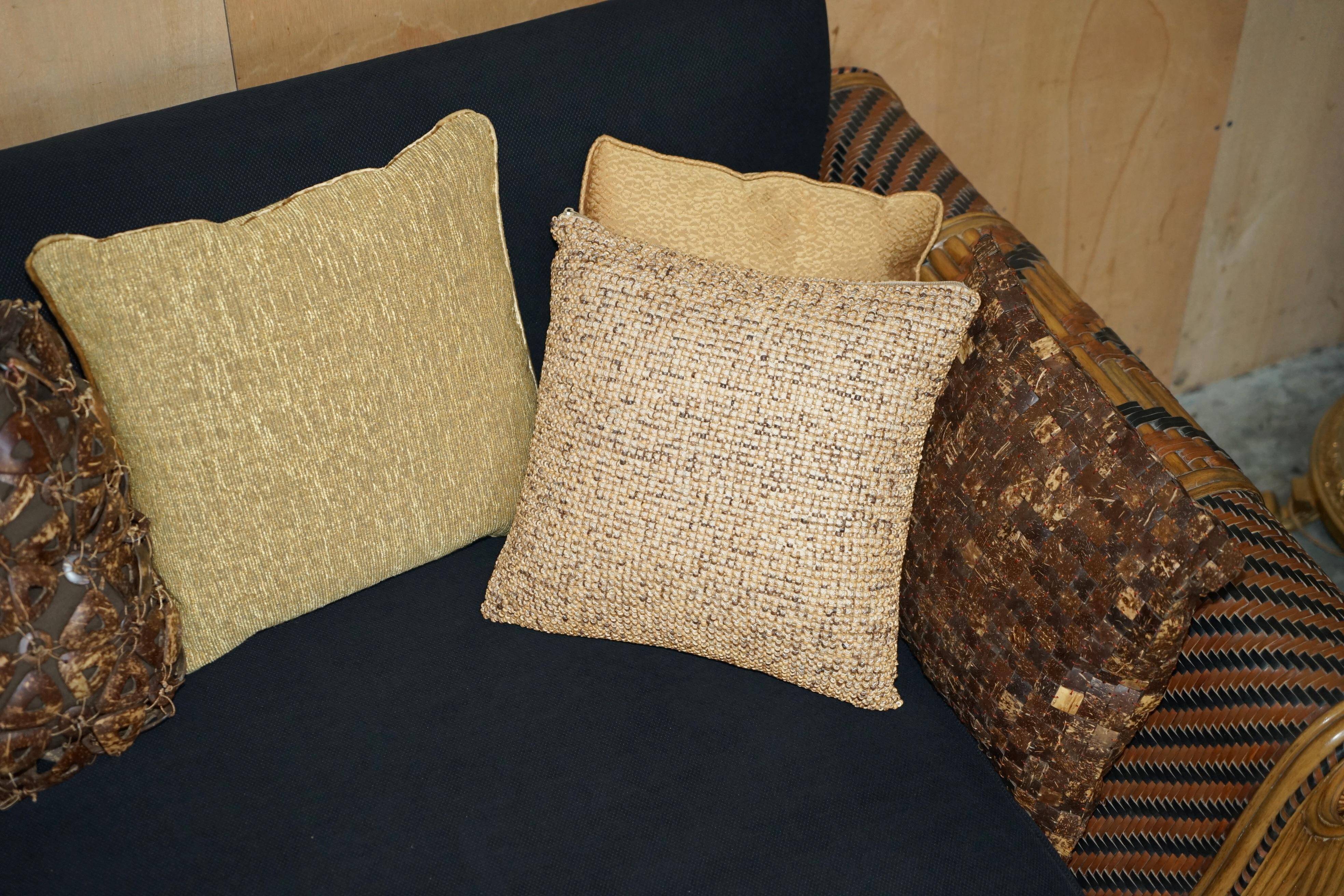 Vintage 1970s canapé with bamboo frame and Aztec patterns.