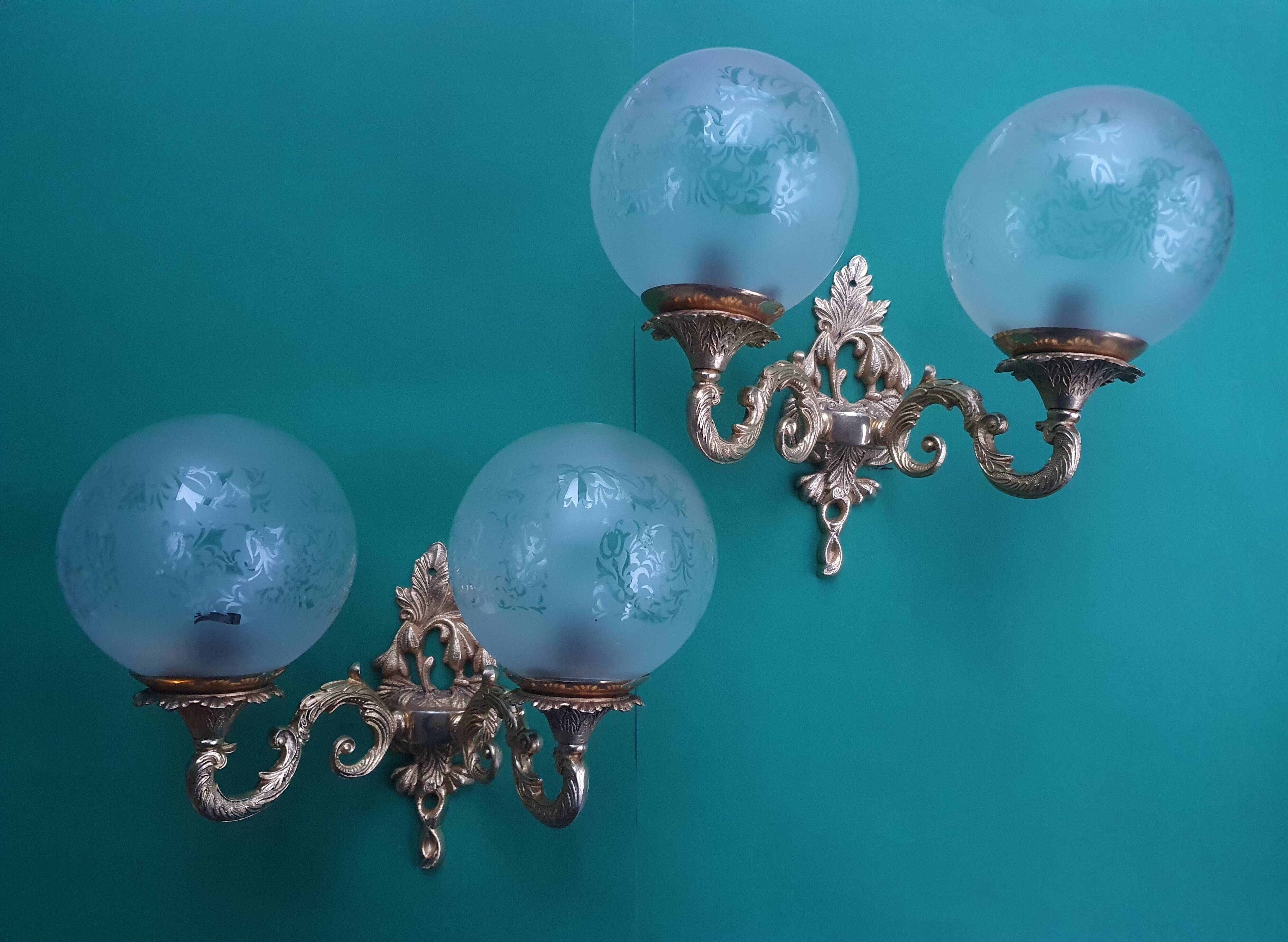 Pair of large double-light wall sconces in vintage brass and glass