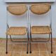 Pair of vintage metal and cane folding chairs