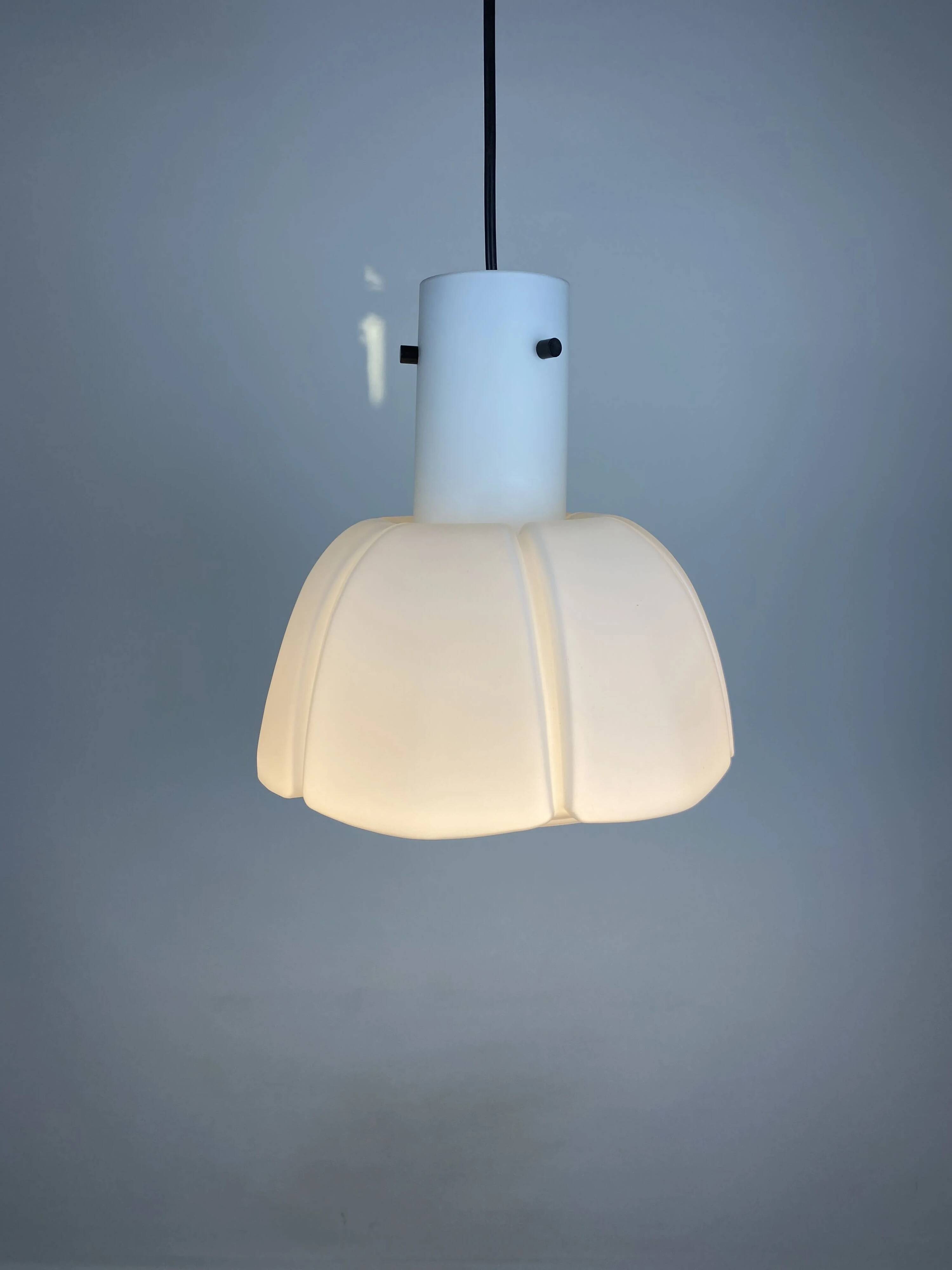 Frosted glass pendant in the shape of a white flower by Glashütte Limburg.