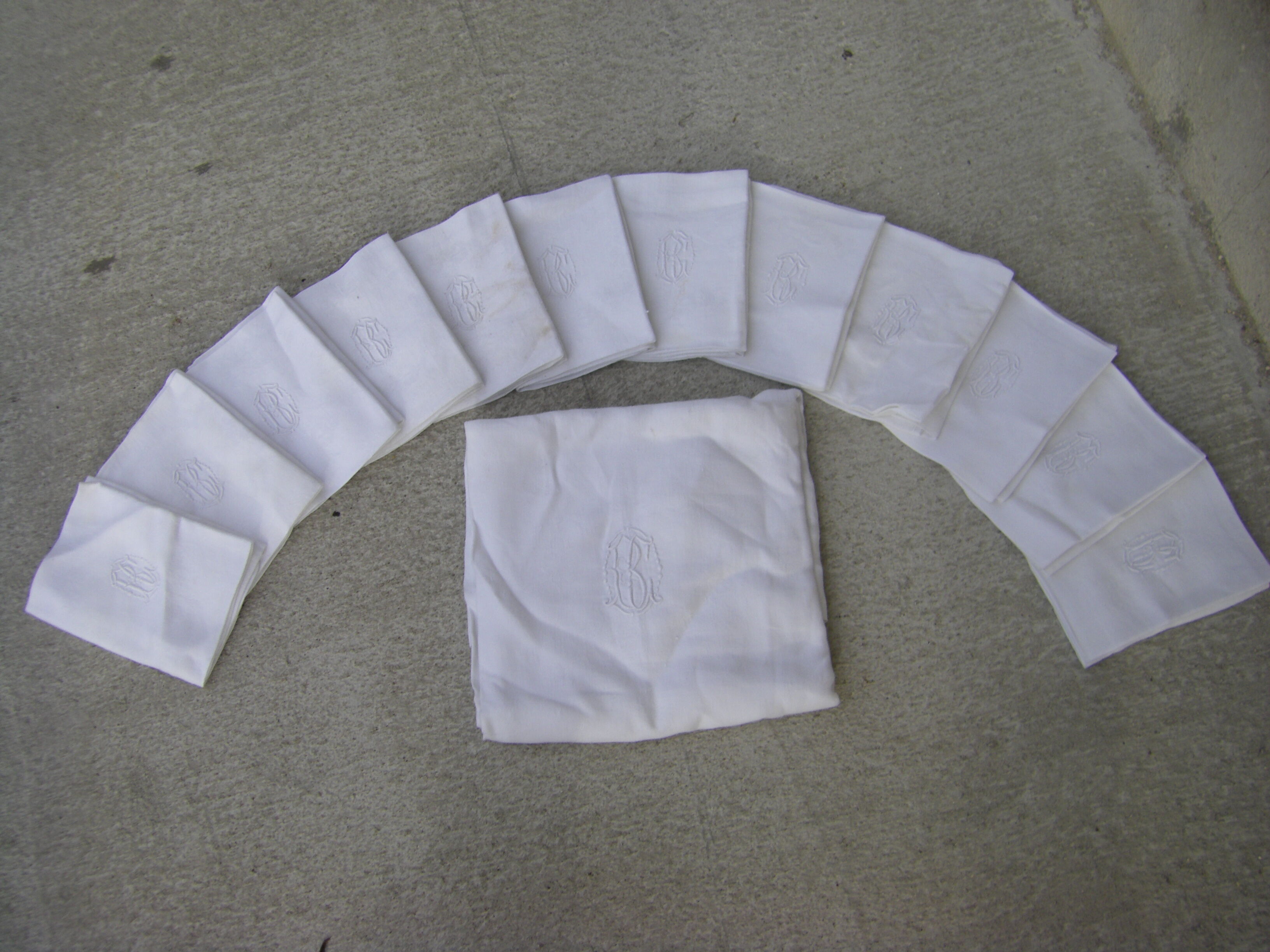 Tablecloth and its twelve monogrammed towels.