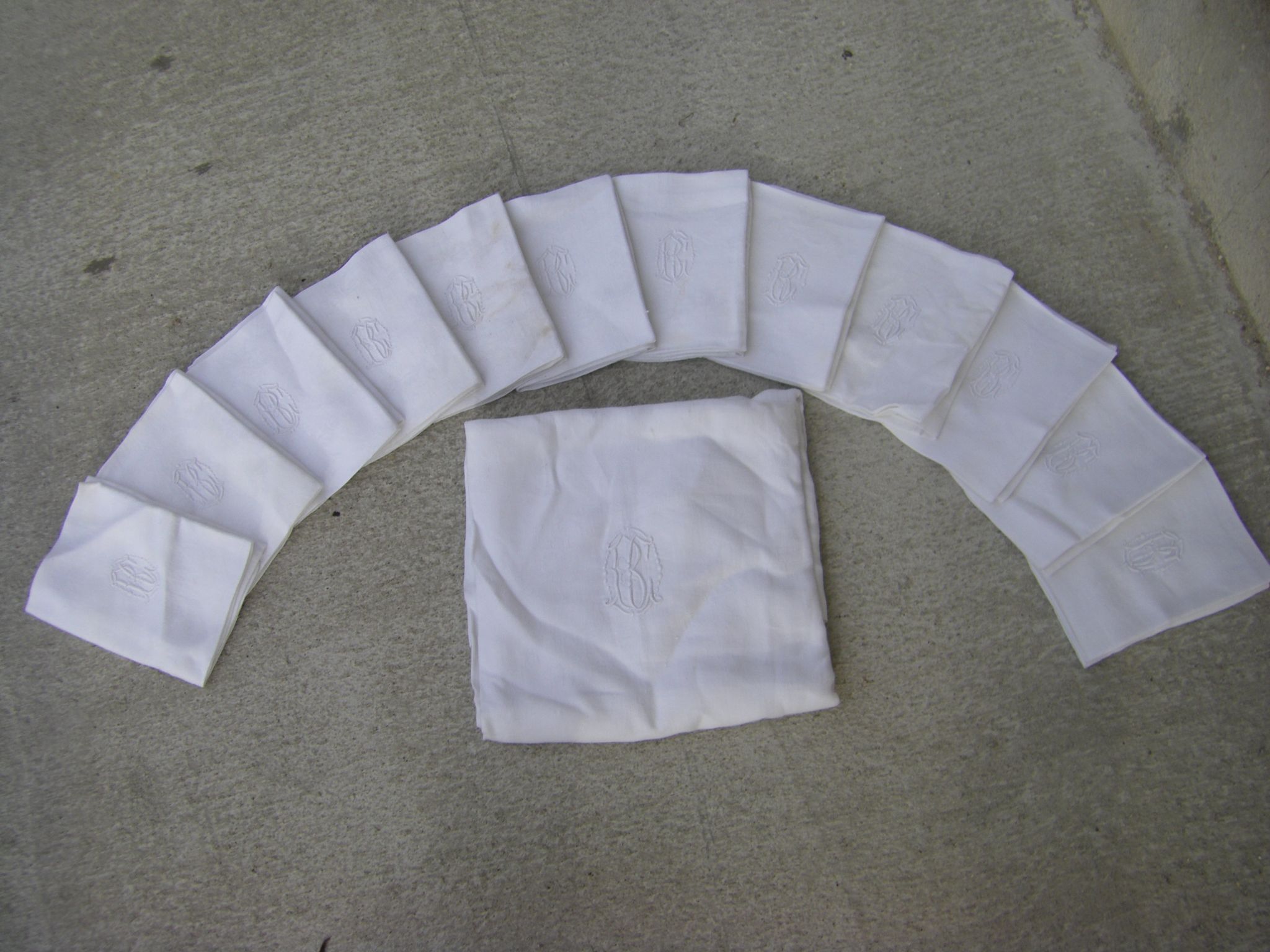 Tablecloth and its twelve monogrammed towels.