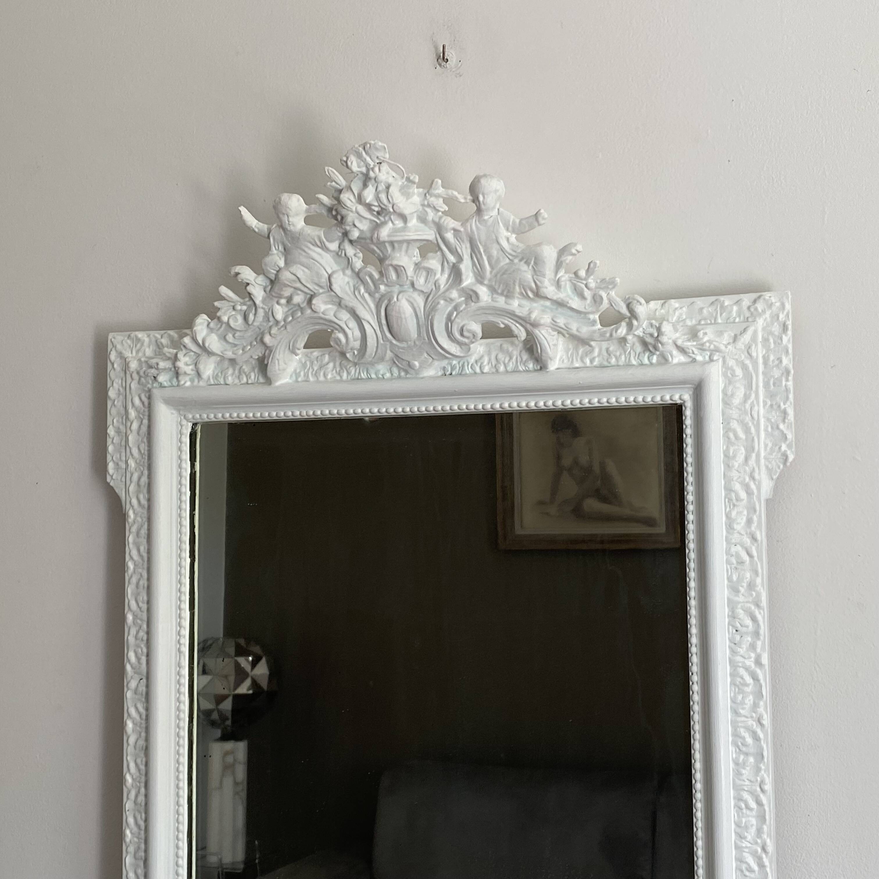 Late 19th century mirror with decorated pediment. 105x80. White.