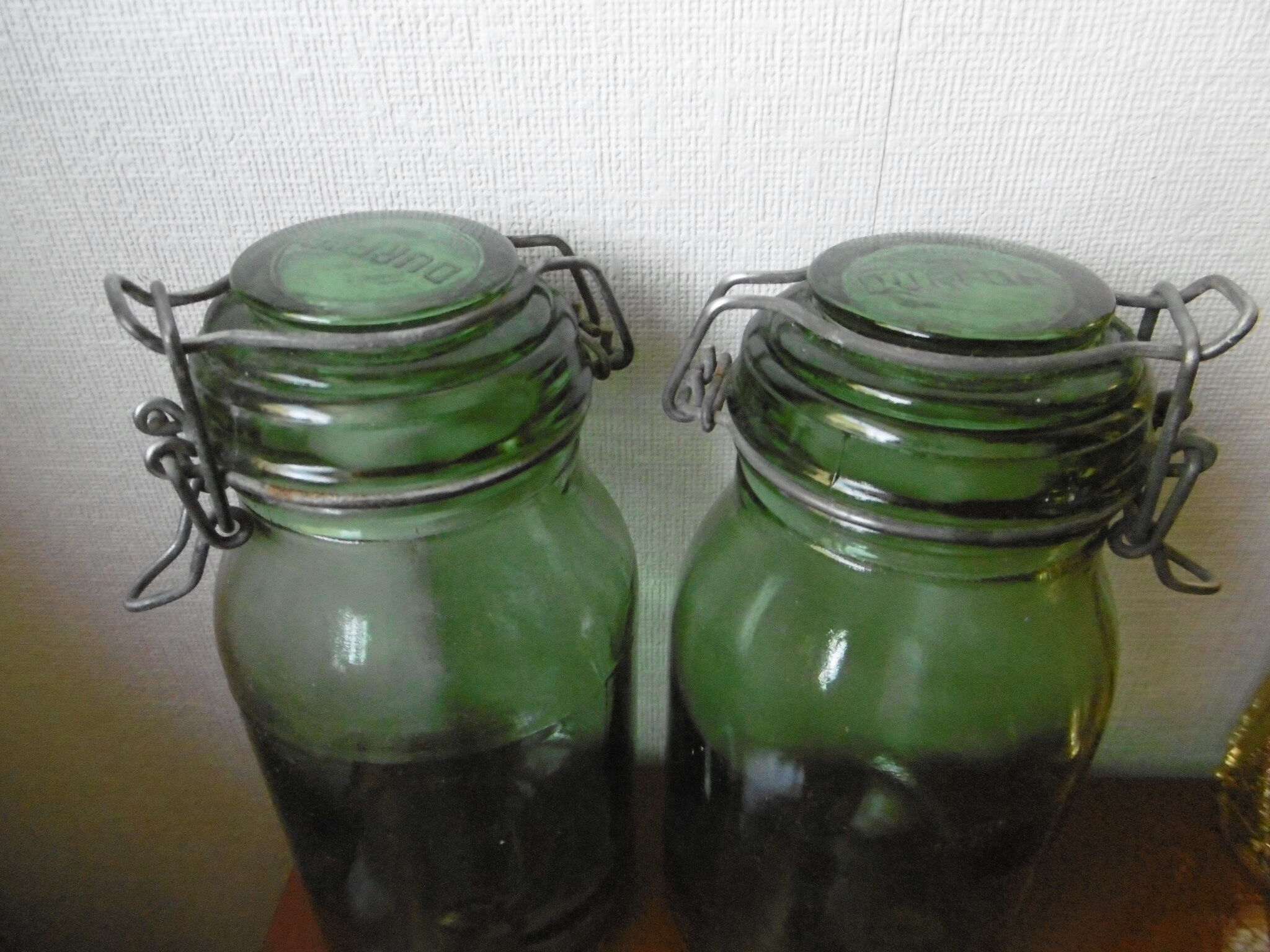 Lot of two old green jars