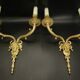 Large pair of wall sconces with male faces in Louis XVI style - bronze