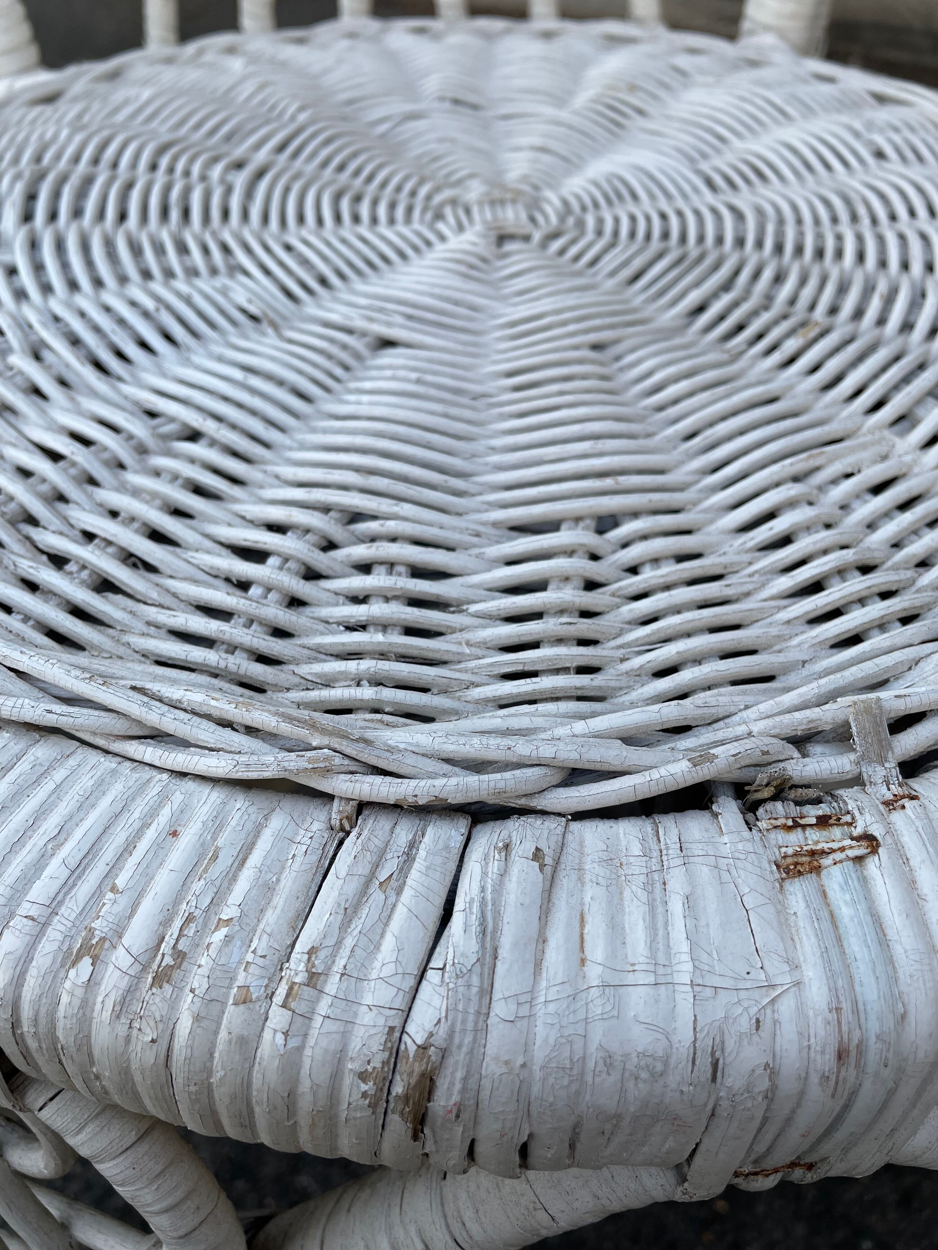 Pair of white peacock rattan chairs, circa 1960
