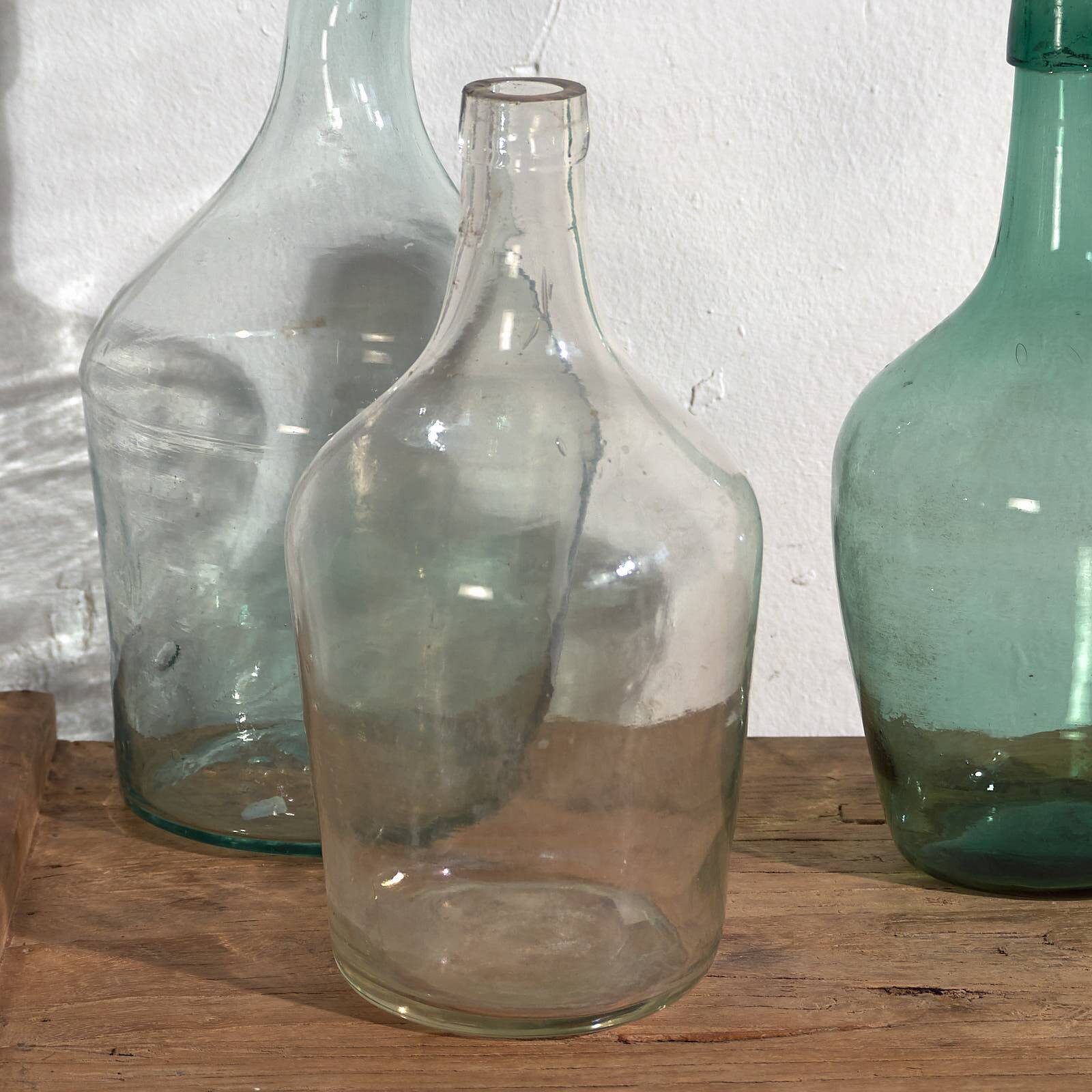 Antique colored demijohns (c.1920). Set of 3 pieces