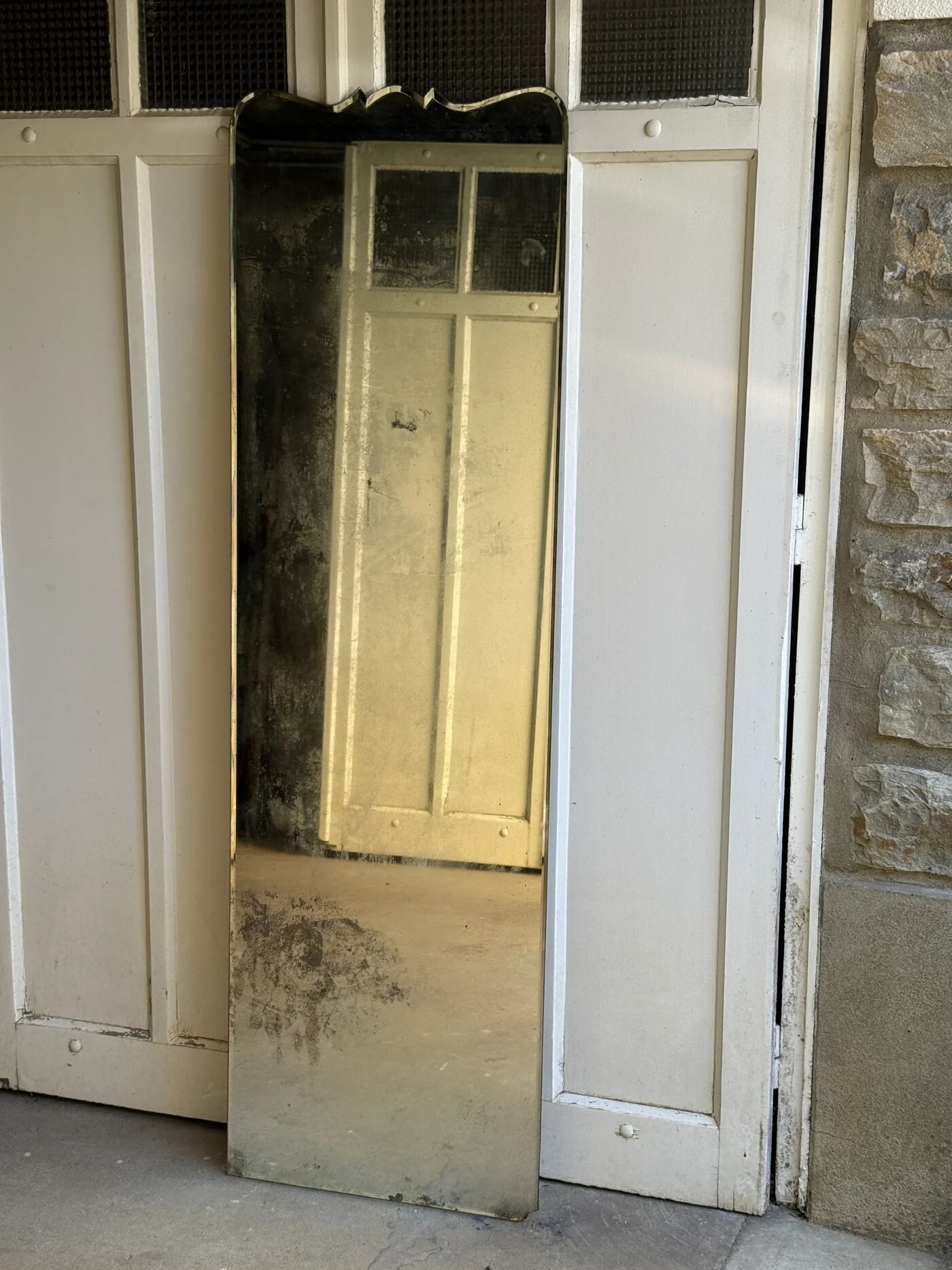 Large vintage mirror with bevelled glass.