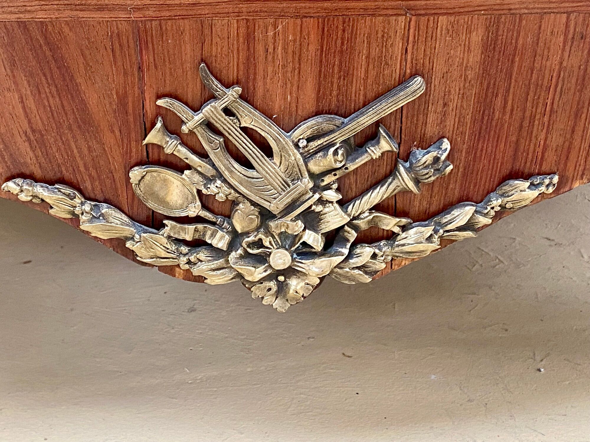 Transition chest of drawers with floral marquetry and music trophy
