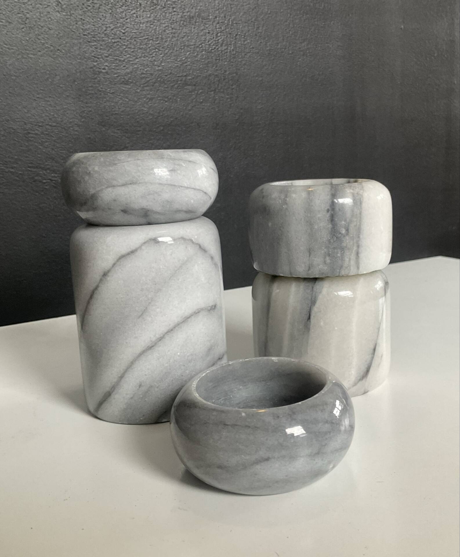 Set of 5 nesting candle holders in white marble.