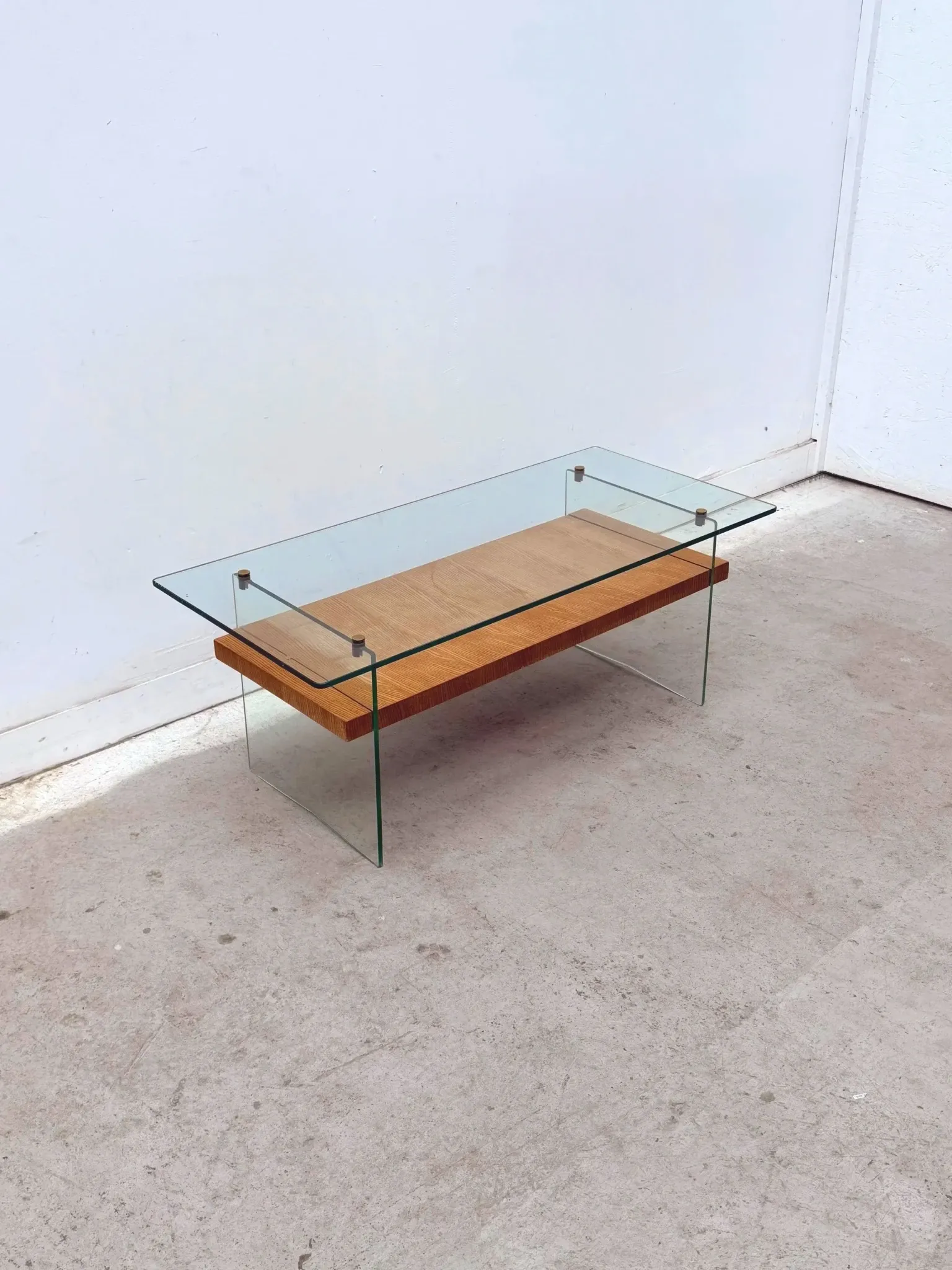 Coffee table by Robert Debiève in ash veneer, glass and brass, France 1950.