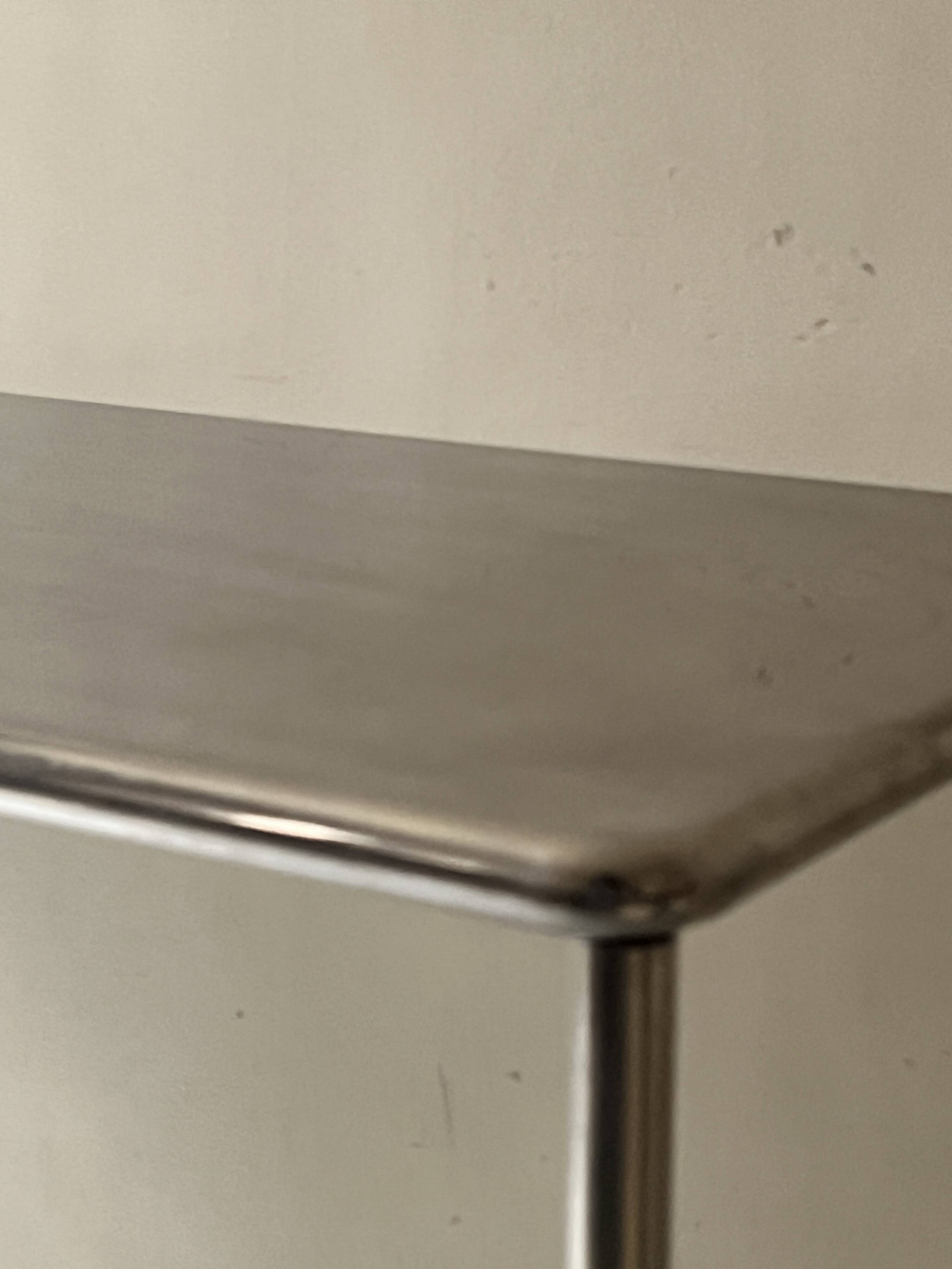 Dining table / tubular and modernist desk in chrome metal