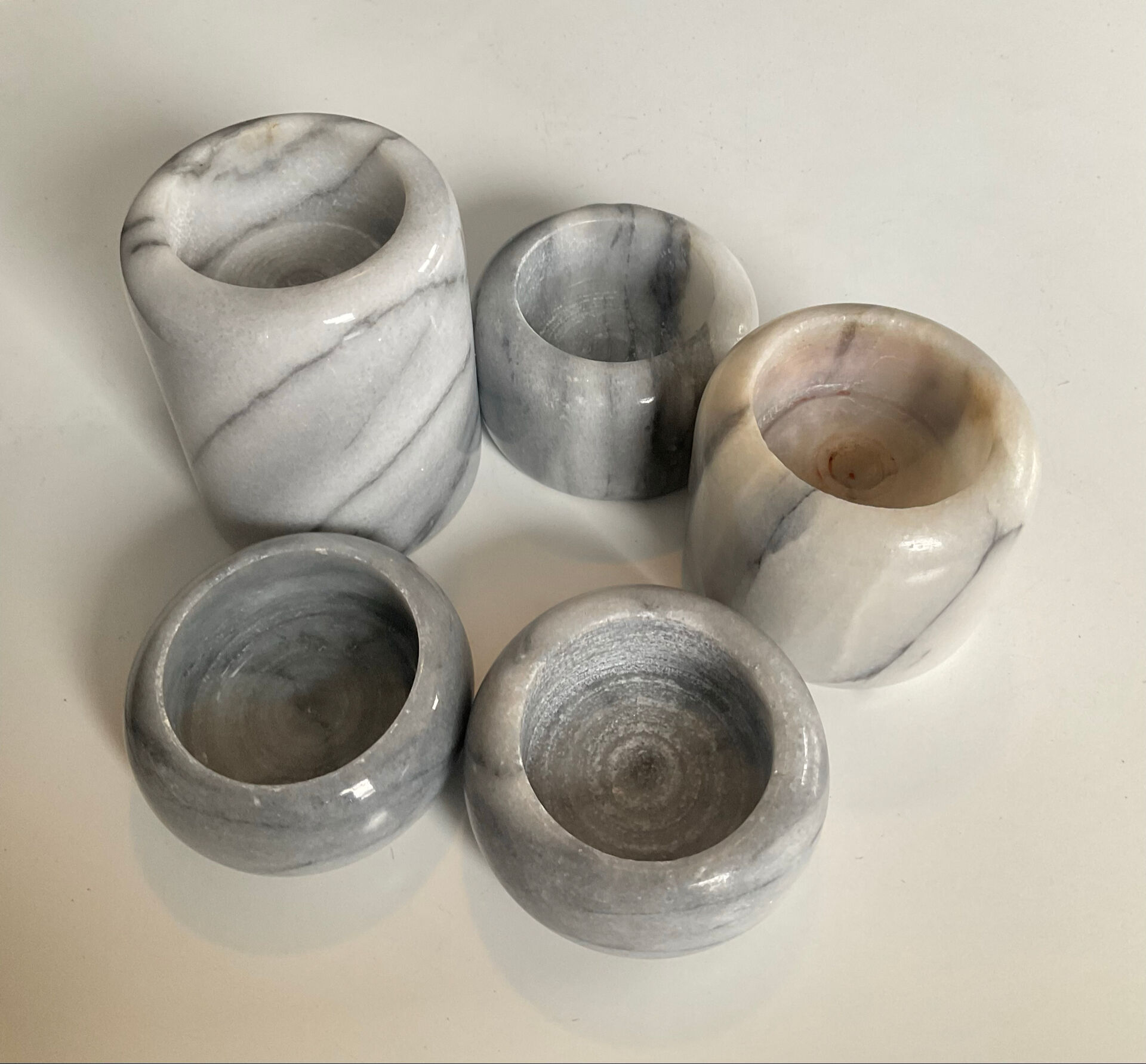 Set of 5 nesting candle holders in white marble.