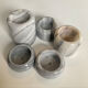 Set of 5 nesting candle holders in white marble.