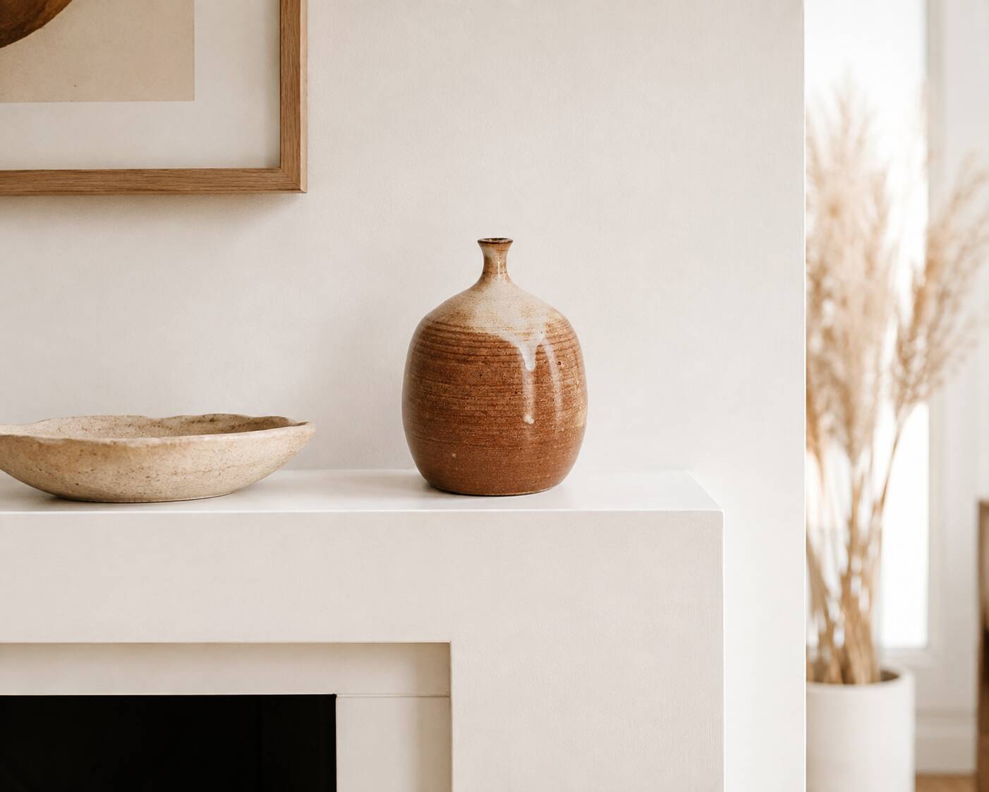 Ovoid vase with a small neck in brown beige ceramic and white drips.