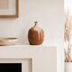 Ovoid vase with a small neck in brown beige ceramic and white drips.