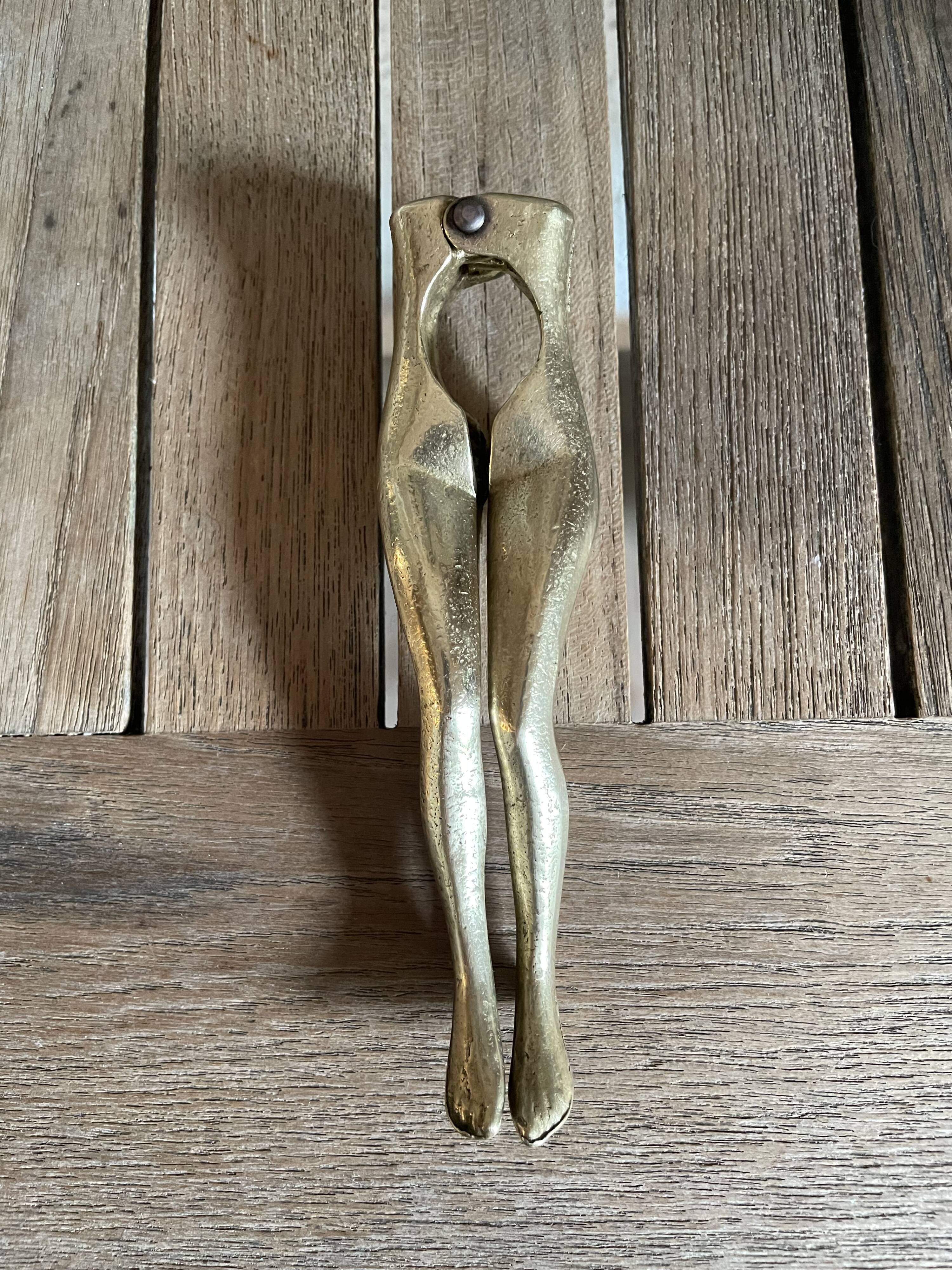 Walnut breaker in the shape of women's legs golden brass vintage