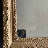 Old small baroque mirror with mercury tin