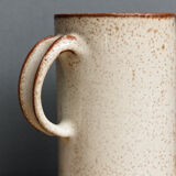 Enamelled sandstone milk jar, signed