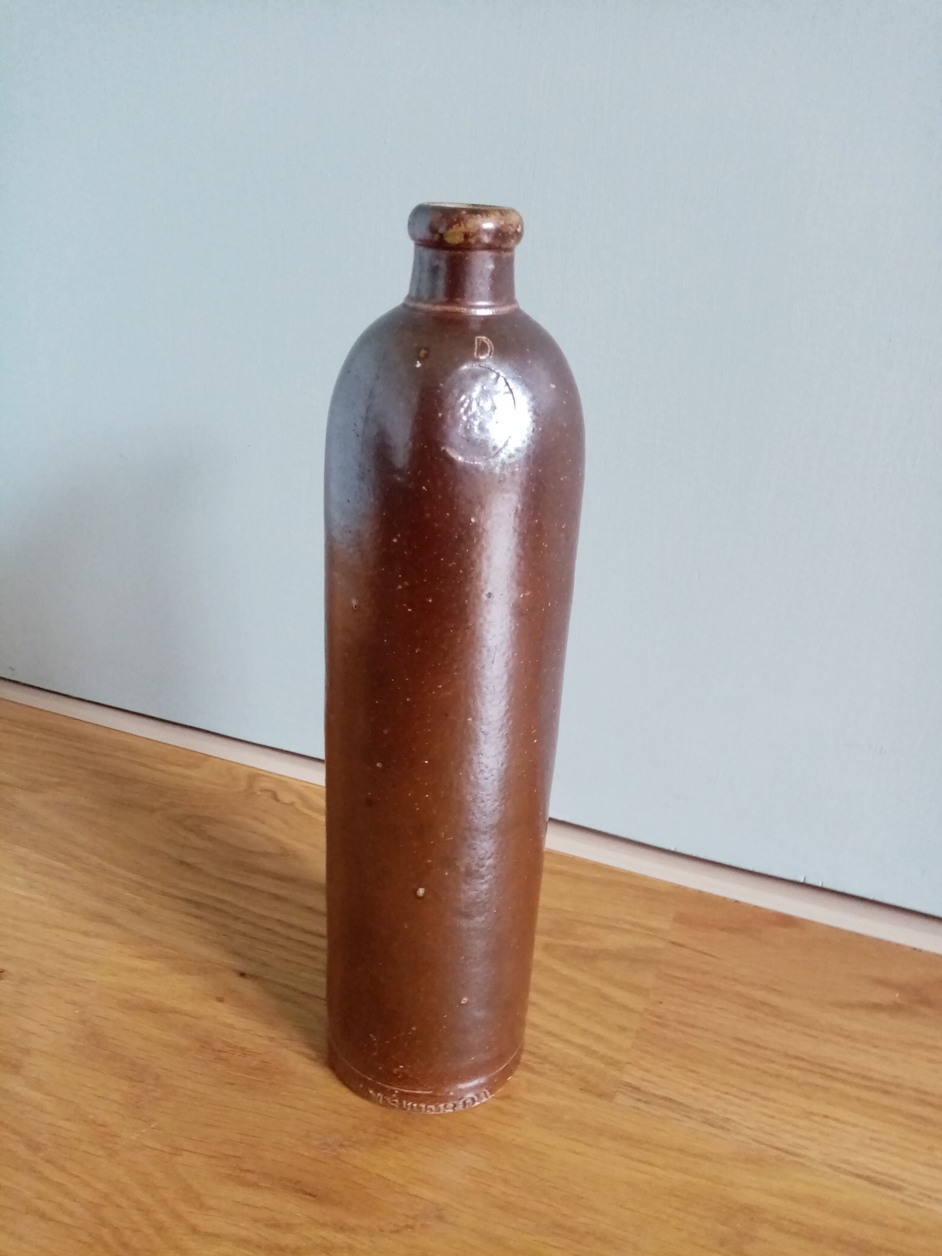 High bottle with brown enamelled sandstone handle Amsterdam