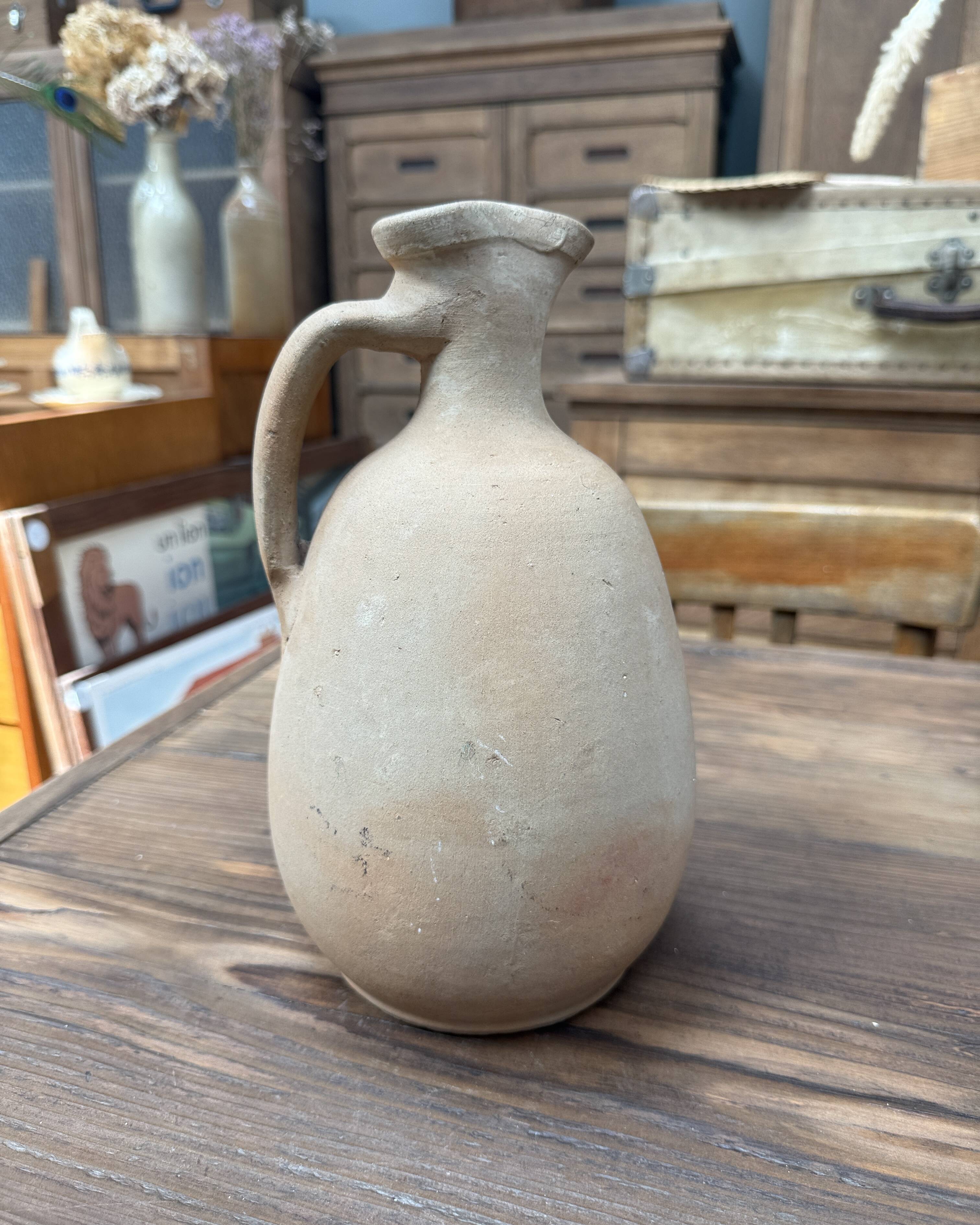 Unfired clay pitcher