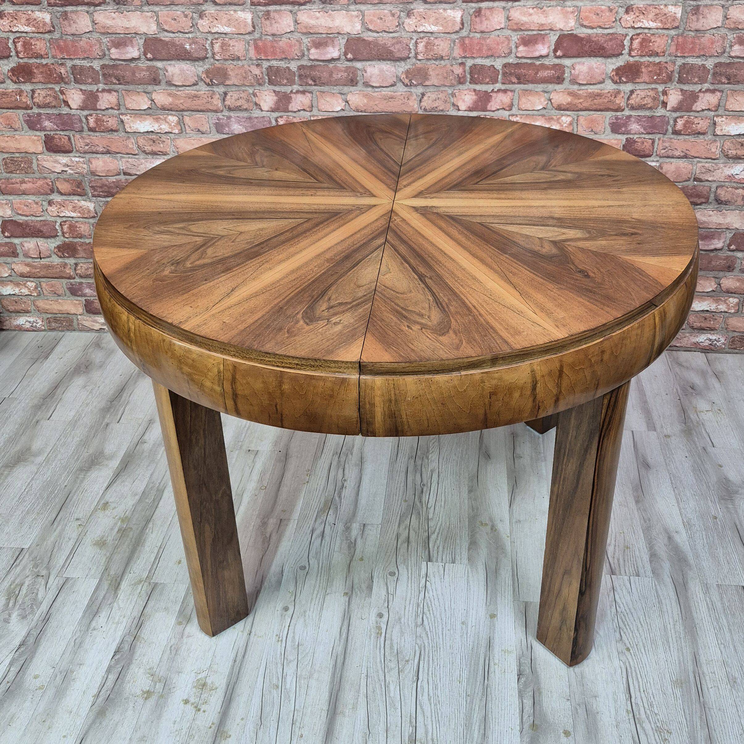 Walnut extendable round table after professional restoration. Art deco.