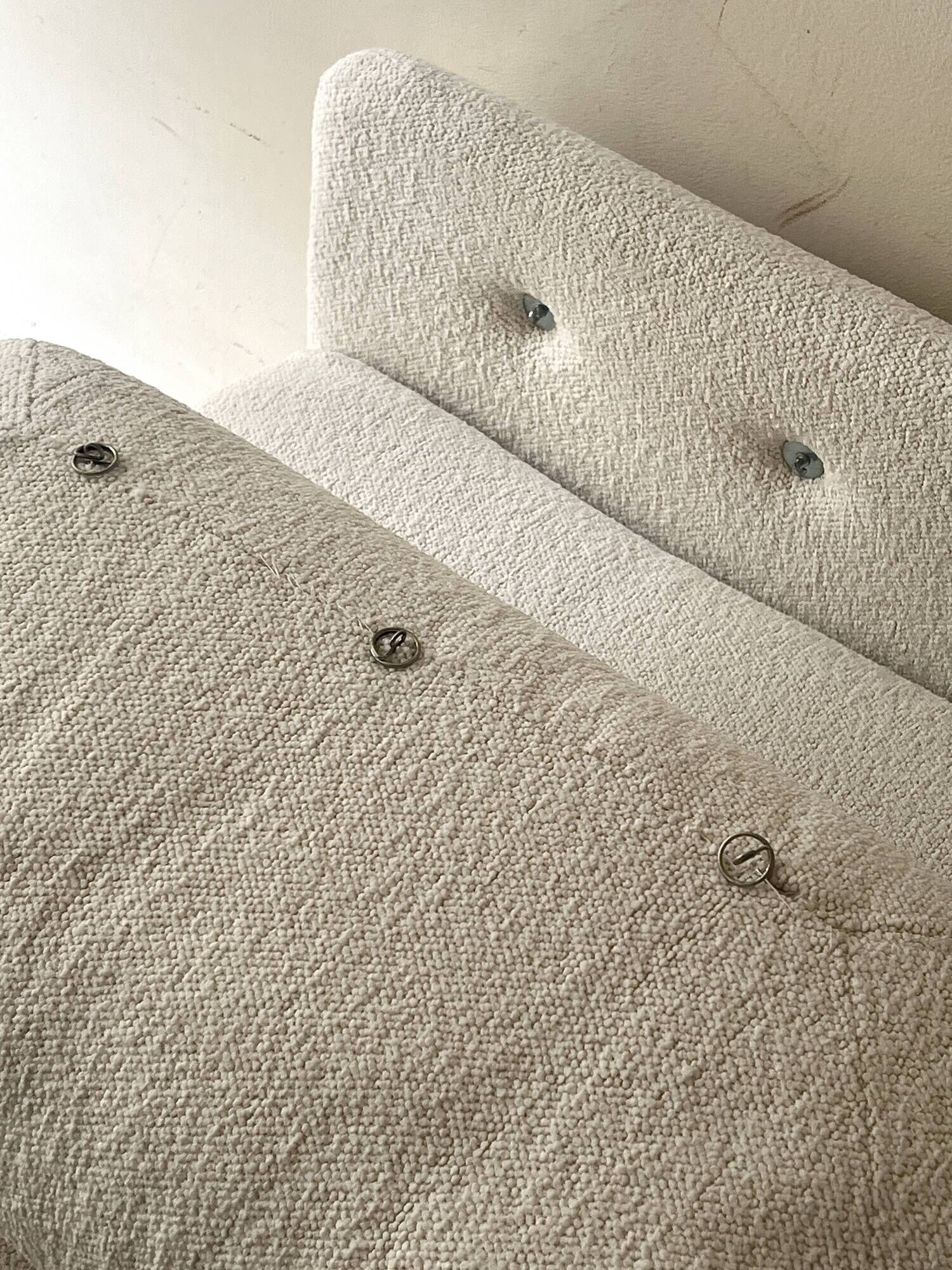 2 Italian off-white chenille armchairs with wooden base, 1970s design.