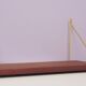 Danish vintage teak wall shelf brass supports