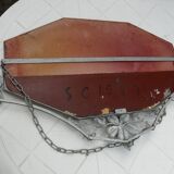 Beveled mirror with art-deco wrought iron frame and floral decor with hanging chain