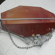 Beveled mirror with art-deco wrought iron frame and floral decor with hanging chain