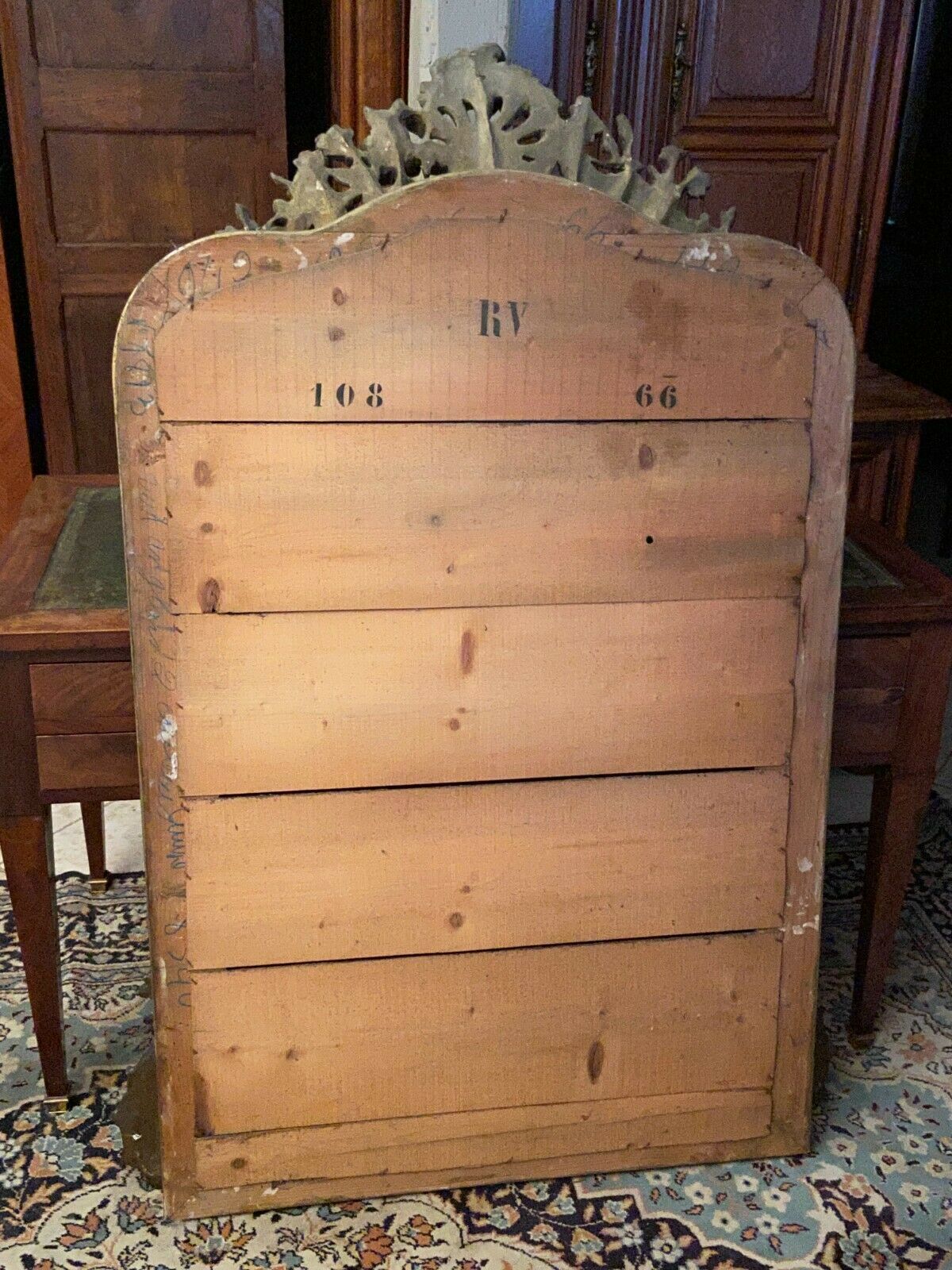 Golden mirror with bevelled ice pediment in Regency style