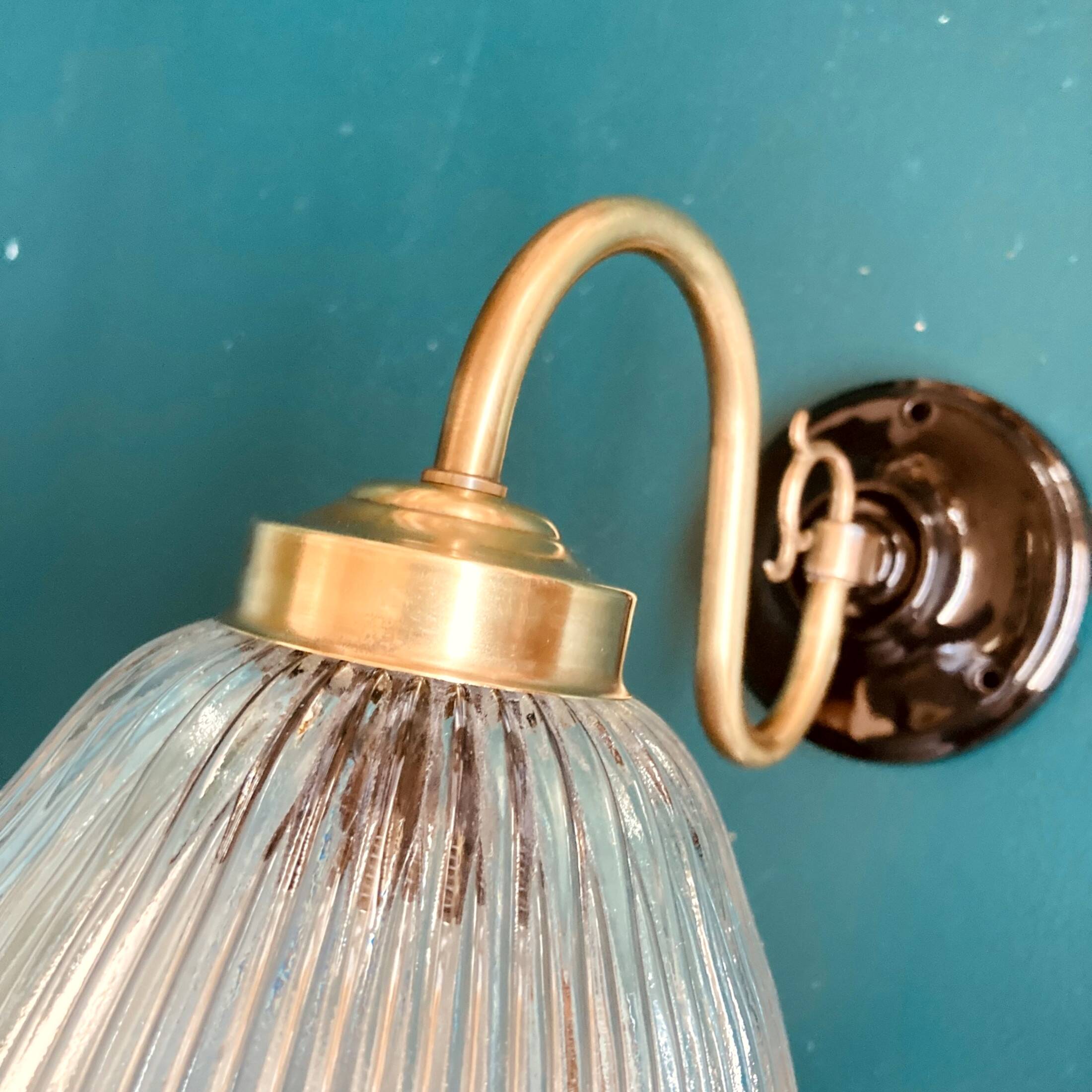 Brass swan neck wall light and prismatic glass tulip vintage porcelain rosette