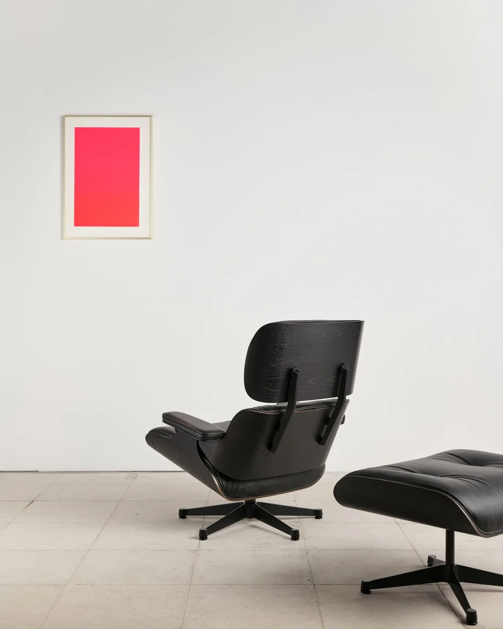 Lounge Chair and ottoman in black leather by Charles & Ray Eames, Vitra