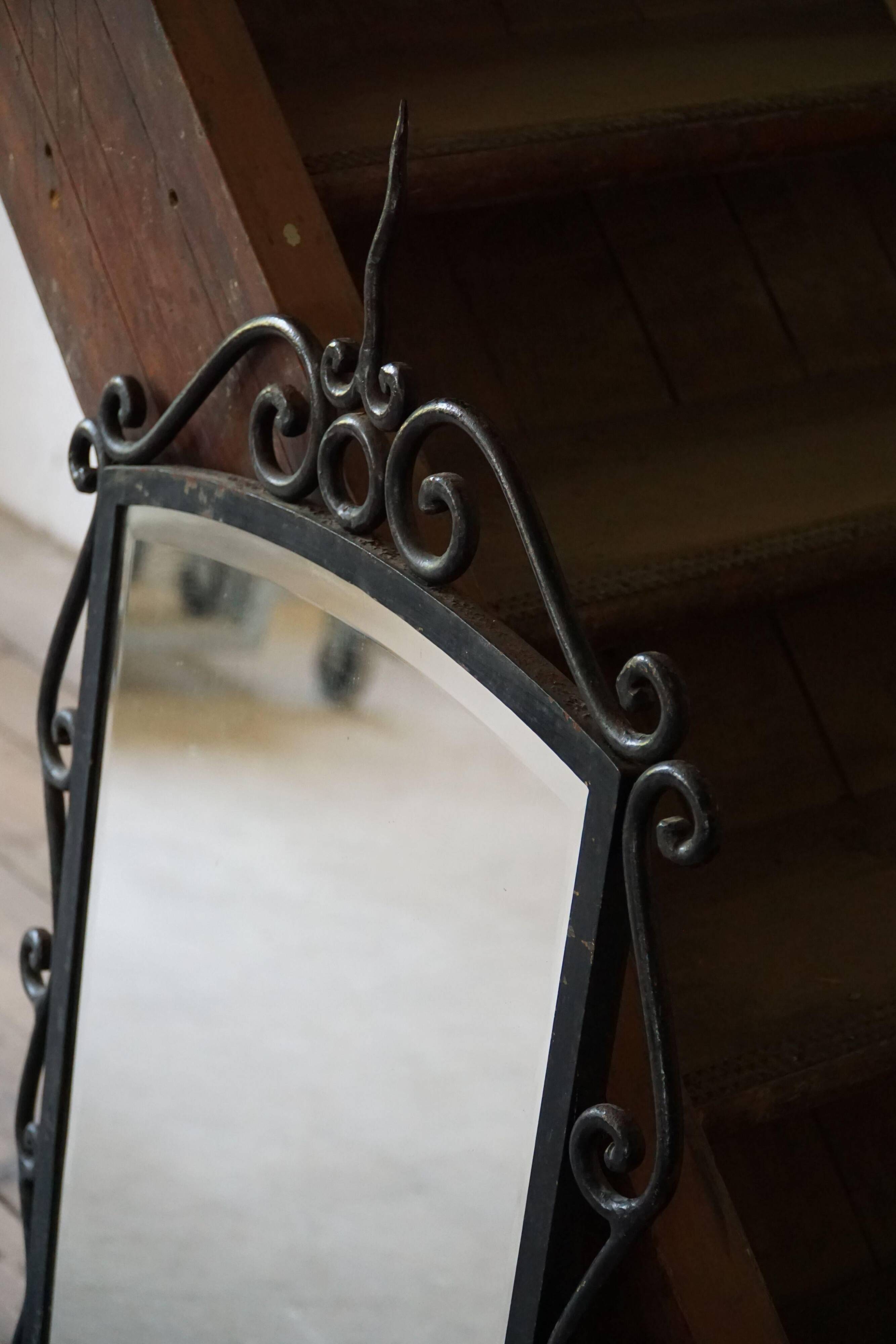 French mid-century brutalist wall mirror in wrought iron, made in the 1950s.