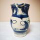 Enamelled ceramic blue pitcher signed by the artist
