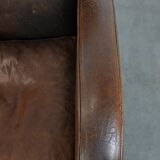Set of two vintage sheepskin leather design armchairs in a cognac colour