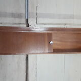 Wall shelf with sliding doors