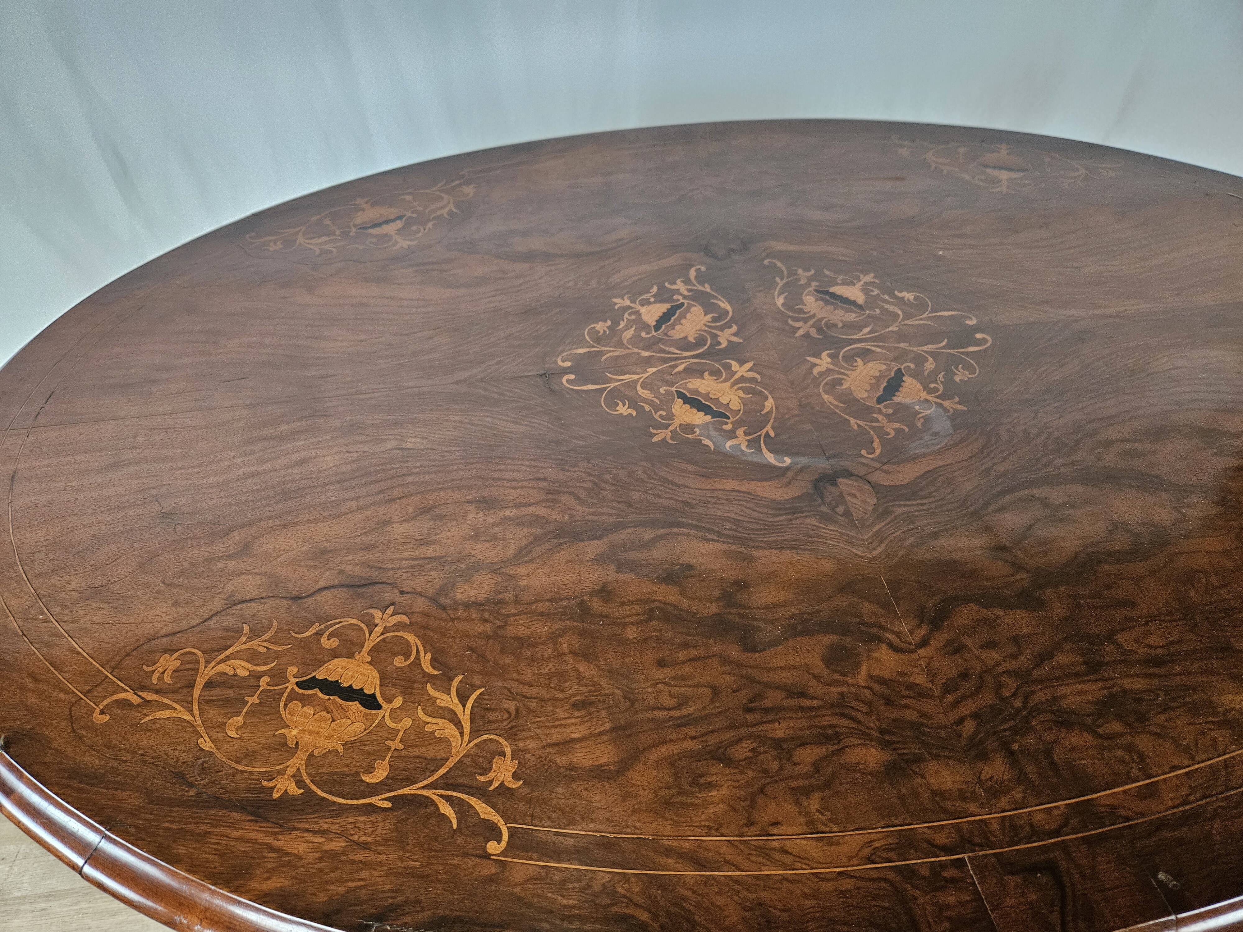 Coffee table in walnut with maple inlays and wheels