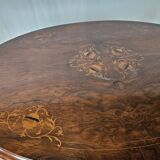 Coffee table in walnut with maple inlays and wheels