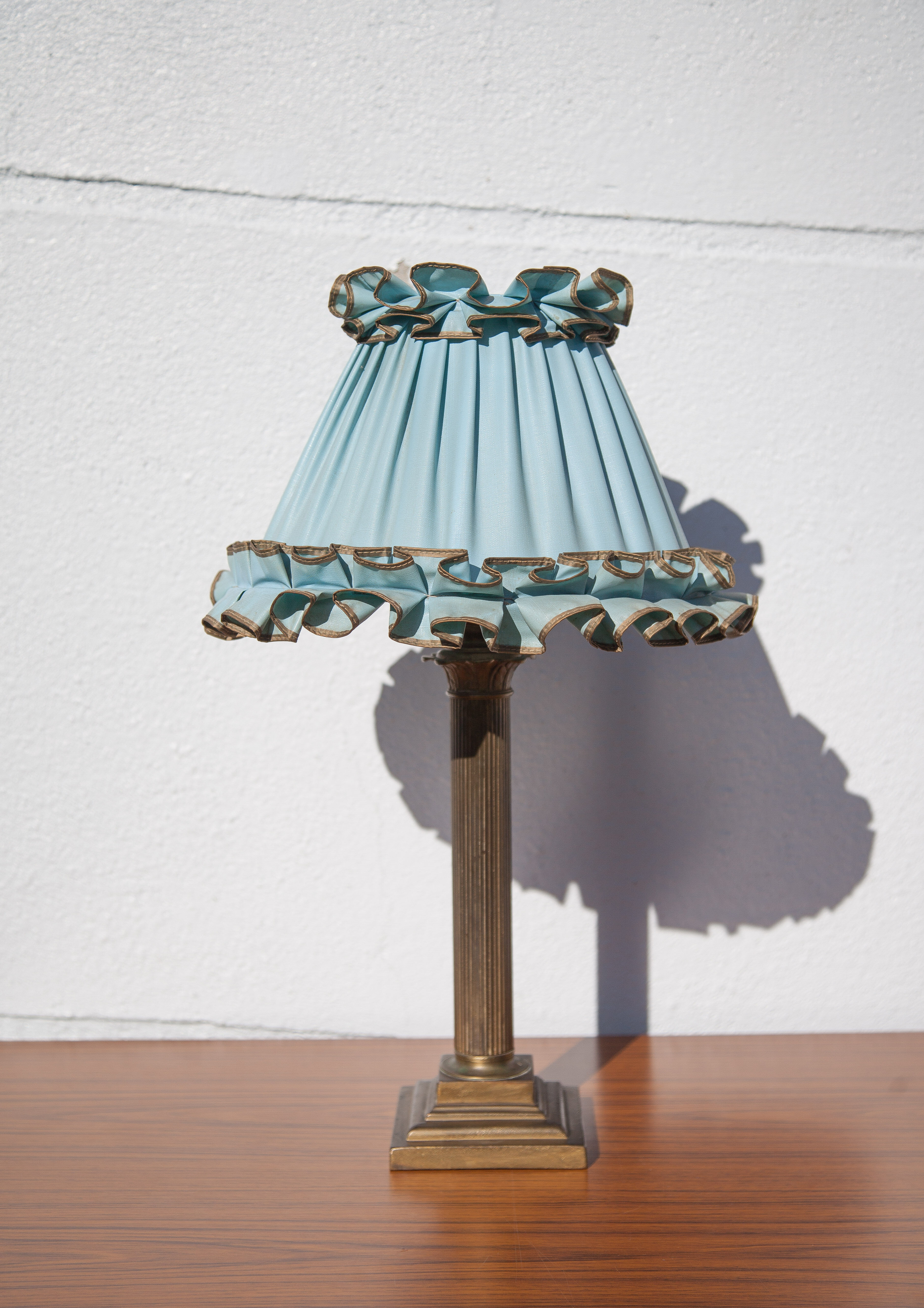 Brass lamp with vintage blue laminated lampshade
