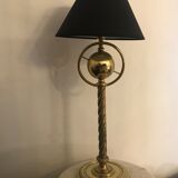 Brass lamp with removable ring around a globe