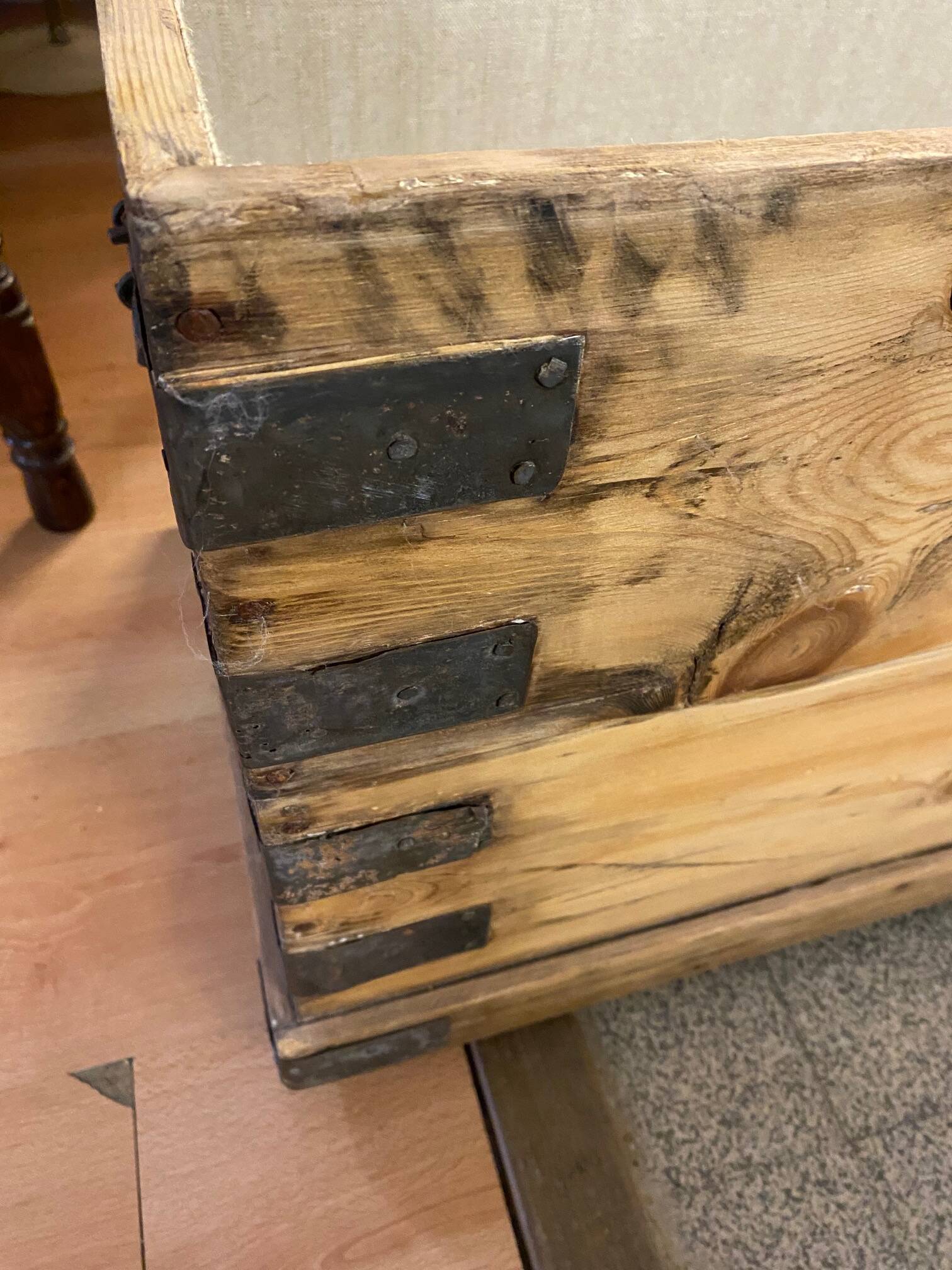 Old trunk in natural pine wood with padded interior