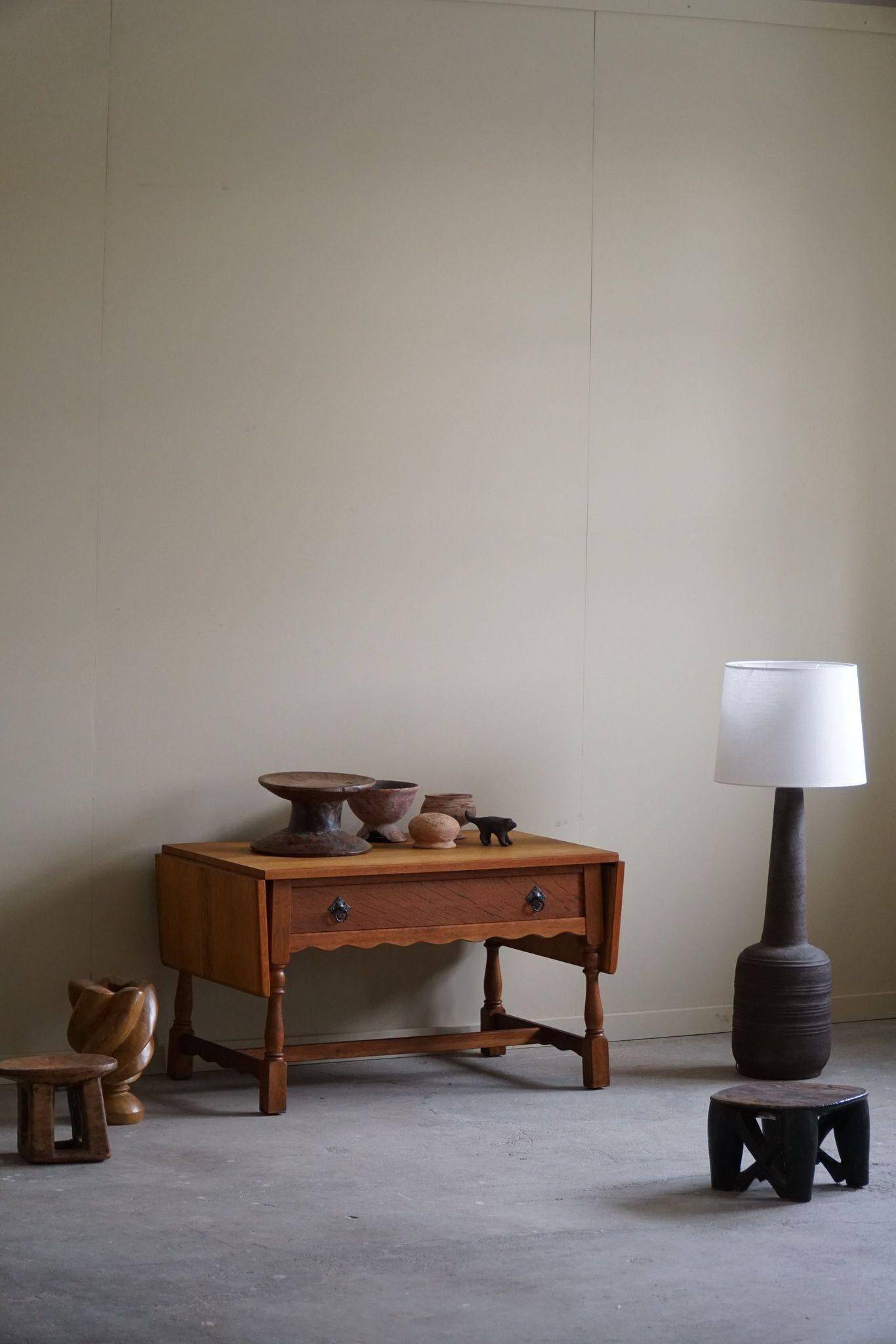 Danish folding table from the mid-century with a drawer in oak, Henning Kjærnulf, 1960s.