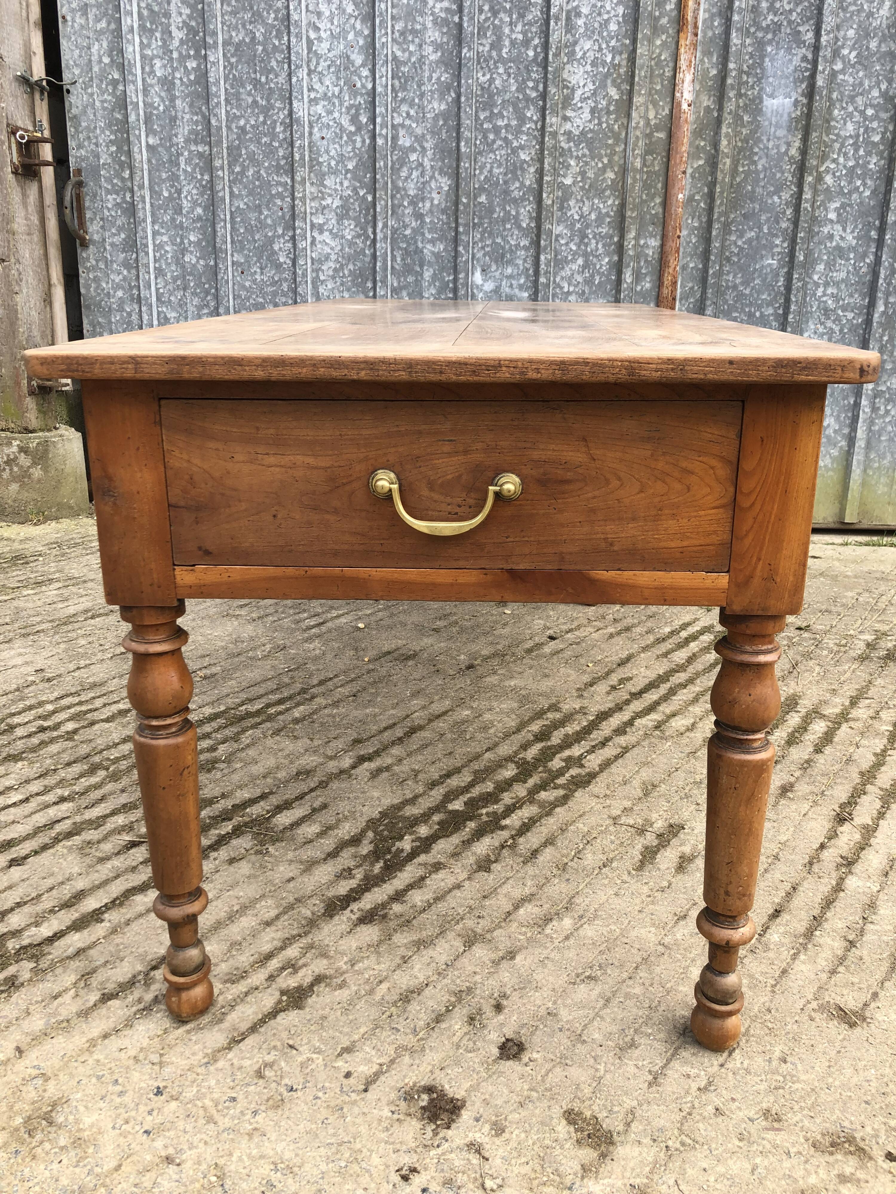 Antique cherry farmhouse table with 2 drawers and 1 pull-out