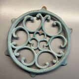 Old cast iron trivety turquoise