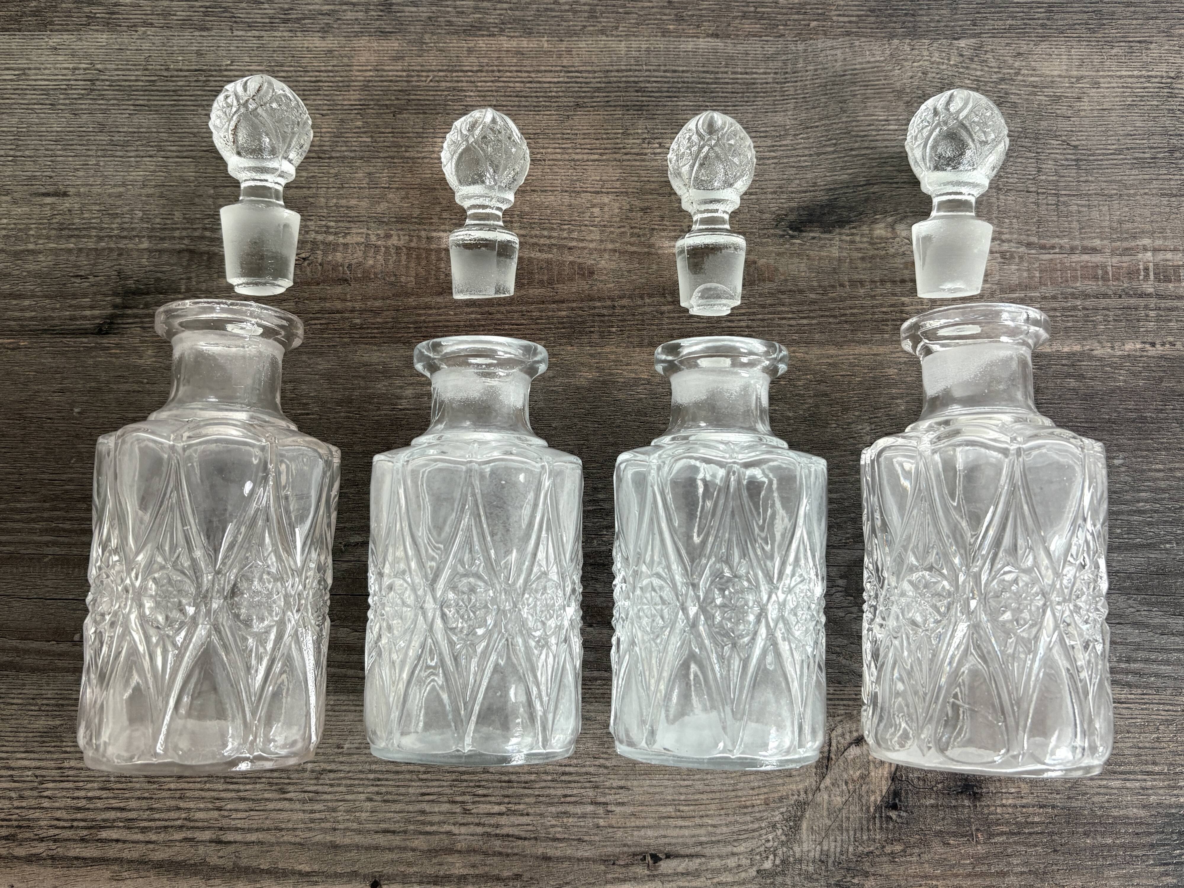 Set of 4 molded crystal bottles – Val Saint Lambert
