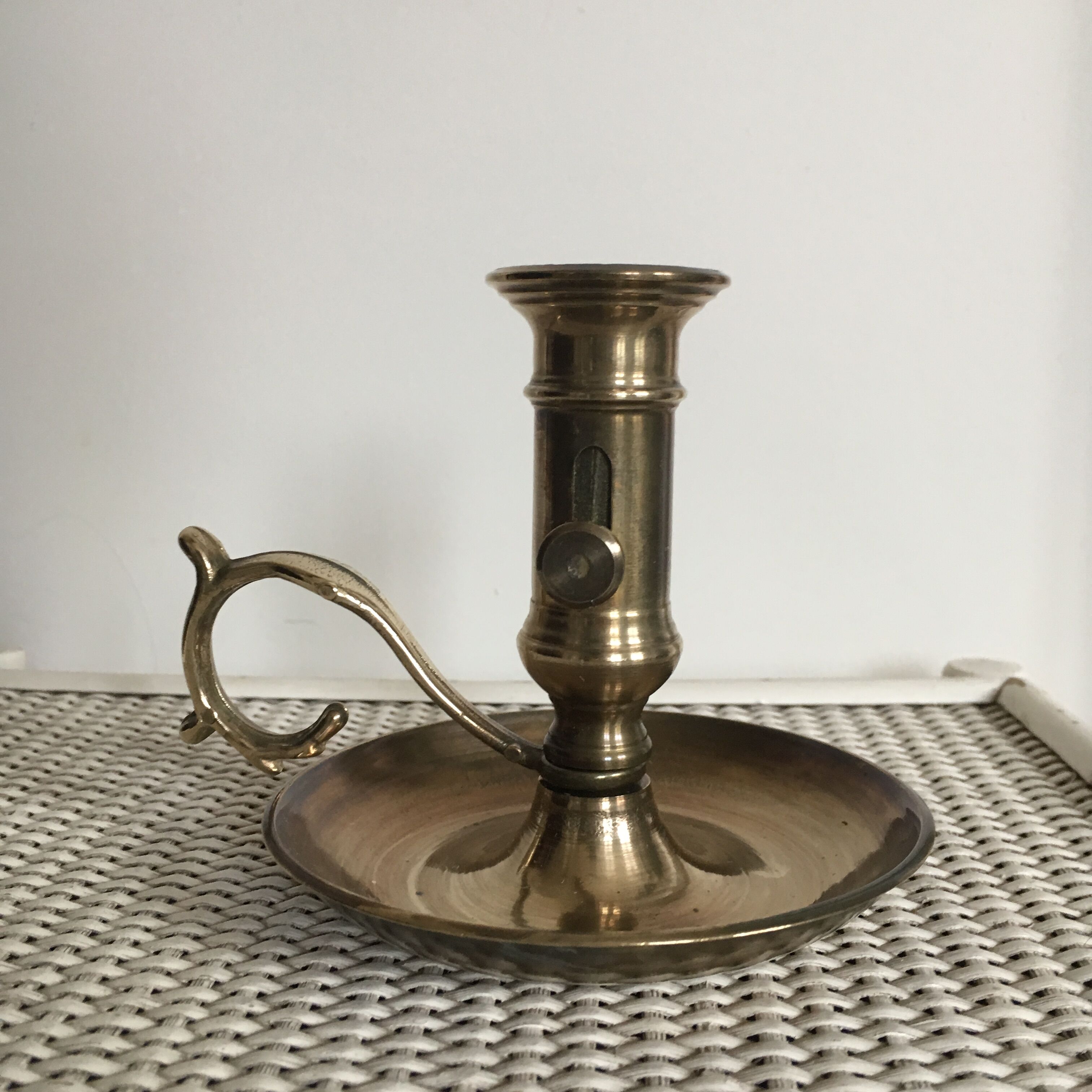 Old brass candlestick called "rat tail"